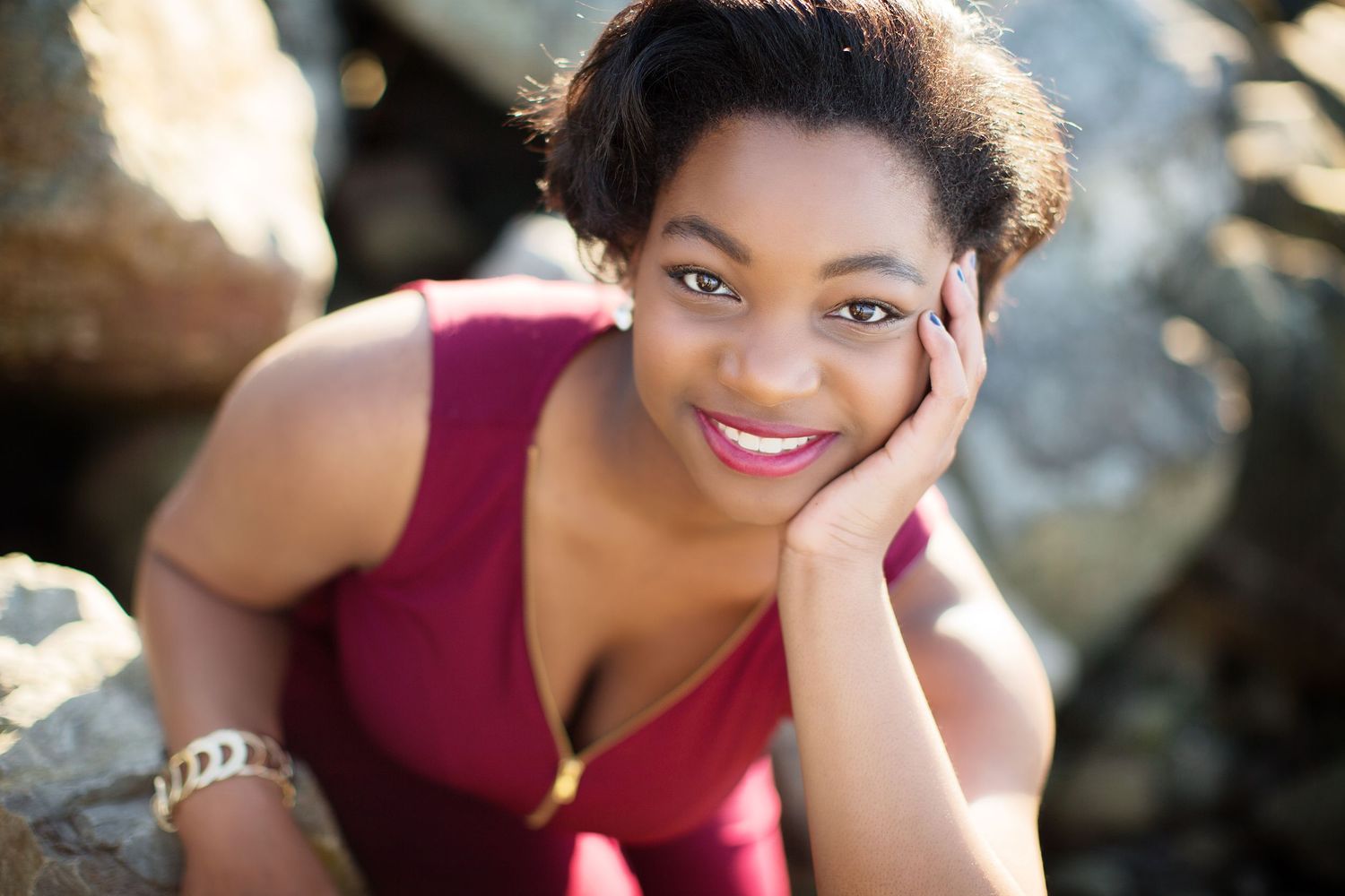 Close-up portraits in burgundy top showing genuine expressions and natural lighting.
