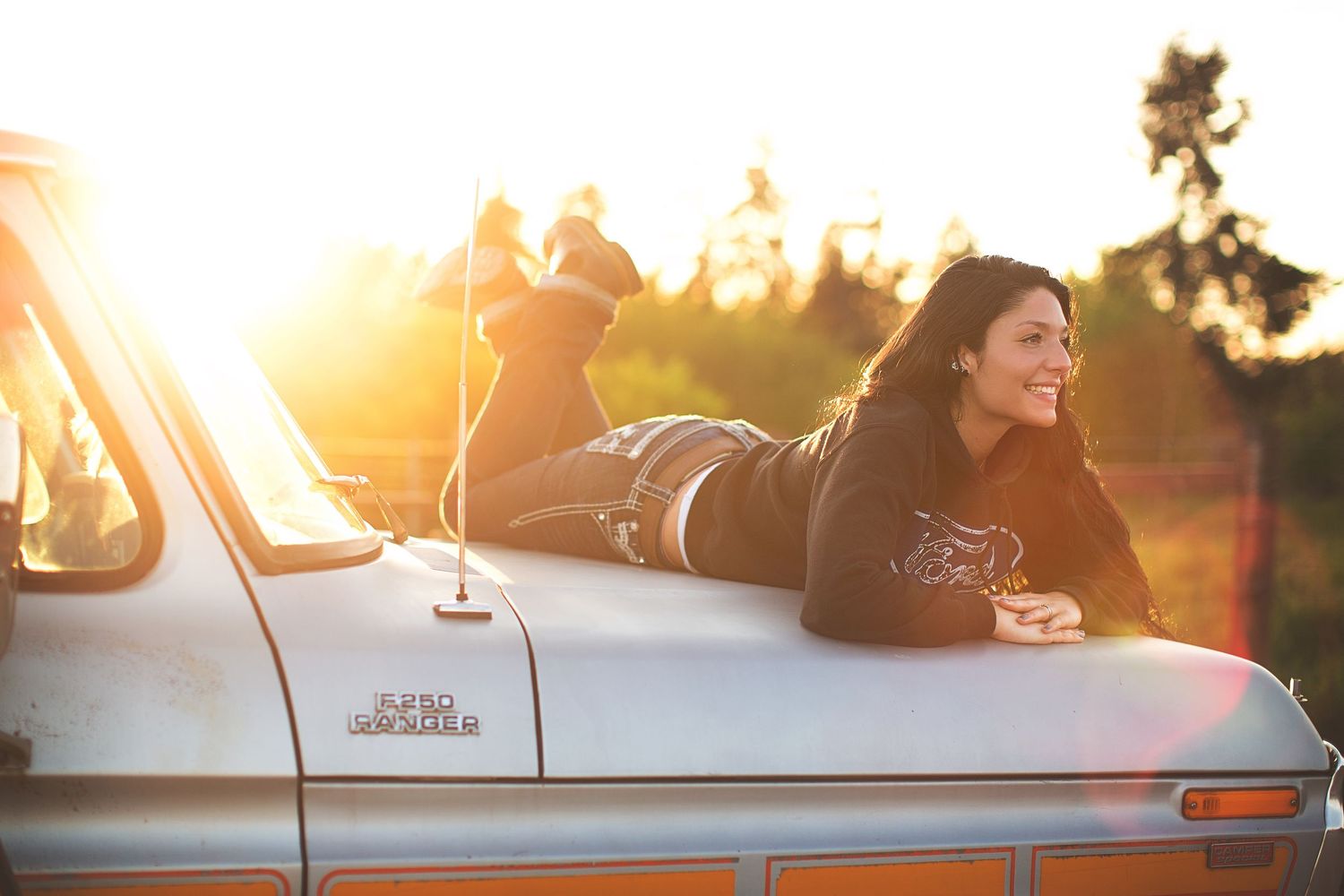 Sunset car photoshoot with warm golden lighting.