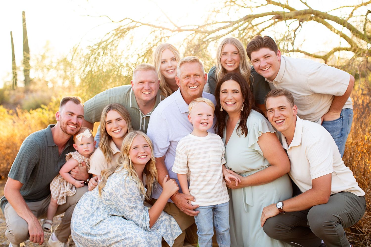 Extended family poses together for casual outdoor portrait session.