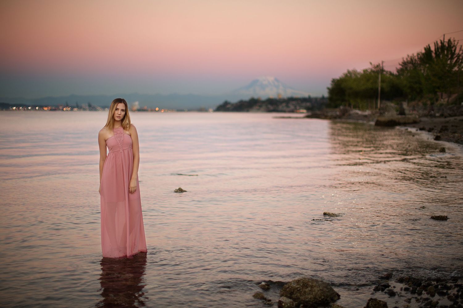 Scenic beach photoshoot at sunset with pink dress.