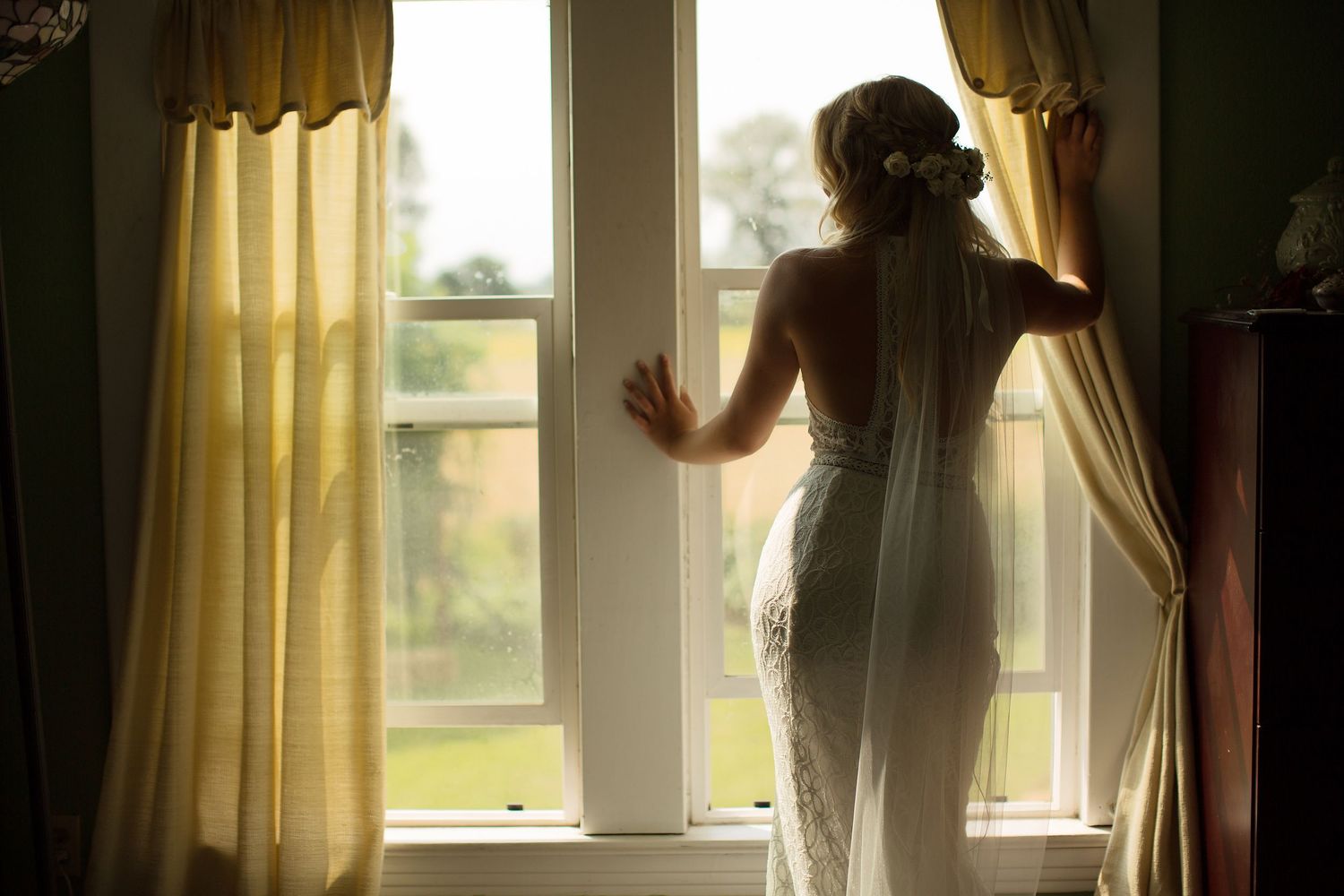 Morning light streams through windows as wedding day preparations take place.