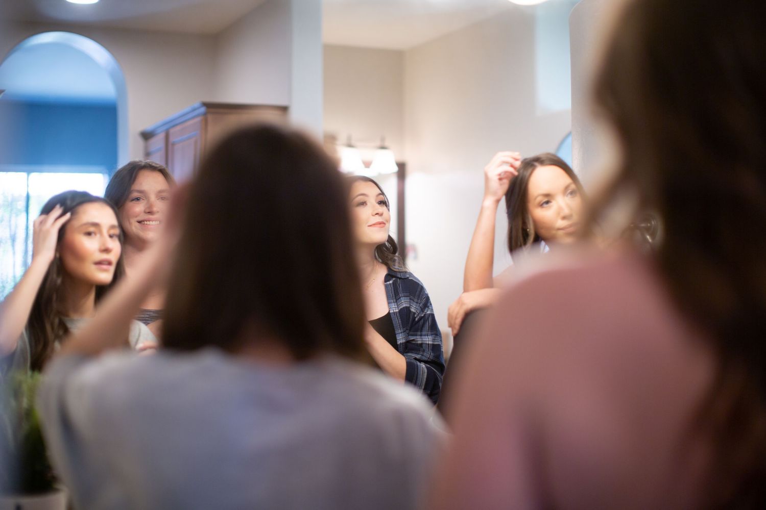 Candid behind-the-scenes moments during an indoor photo session.