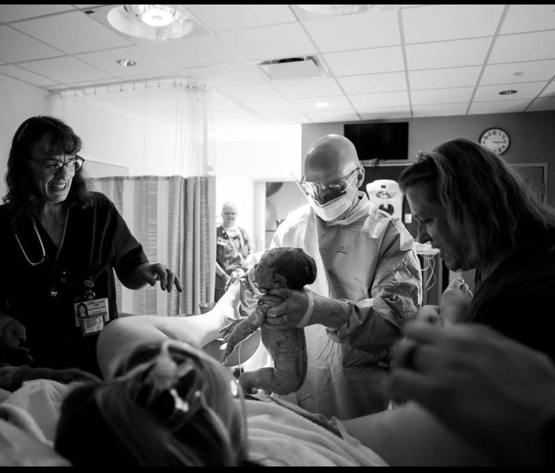 Black and white candid shots of wedding preparations with guests getting ready in a bright room.
