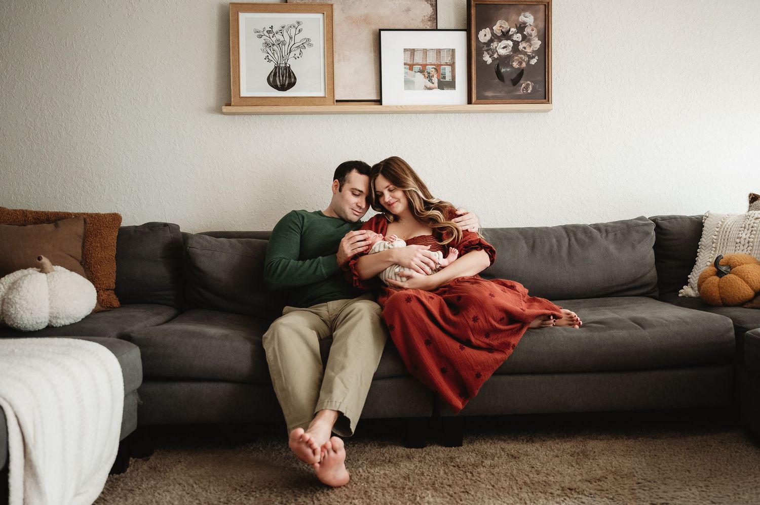 A series of intimate lifestyle photos showing a couple relaxing together on a gray couch in a minimalist room.