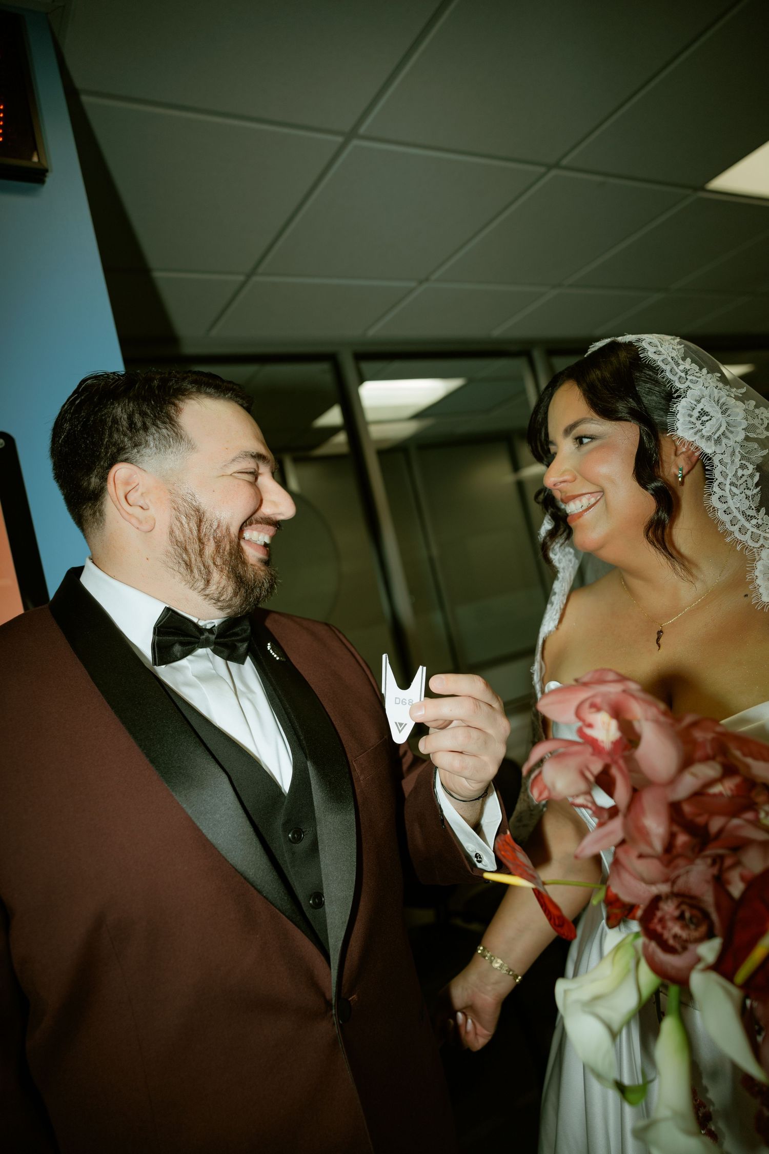 A joyful couple shares a candid moment together during their wedding celebration.