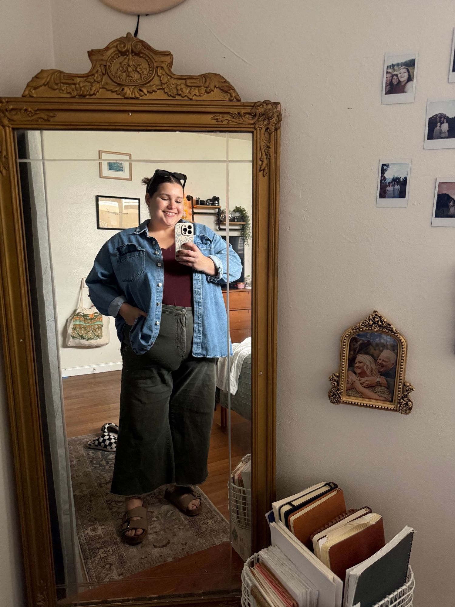 A series of mirrored reflections showing someone trying on a denim jacket in a vintage-style bedroom setting.