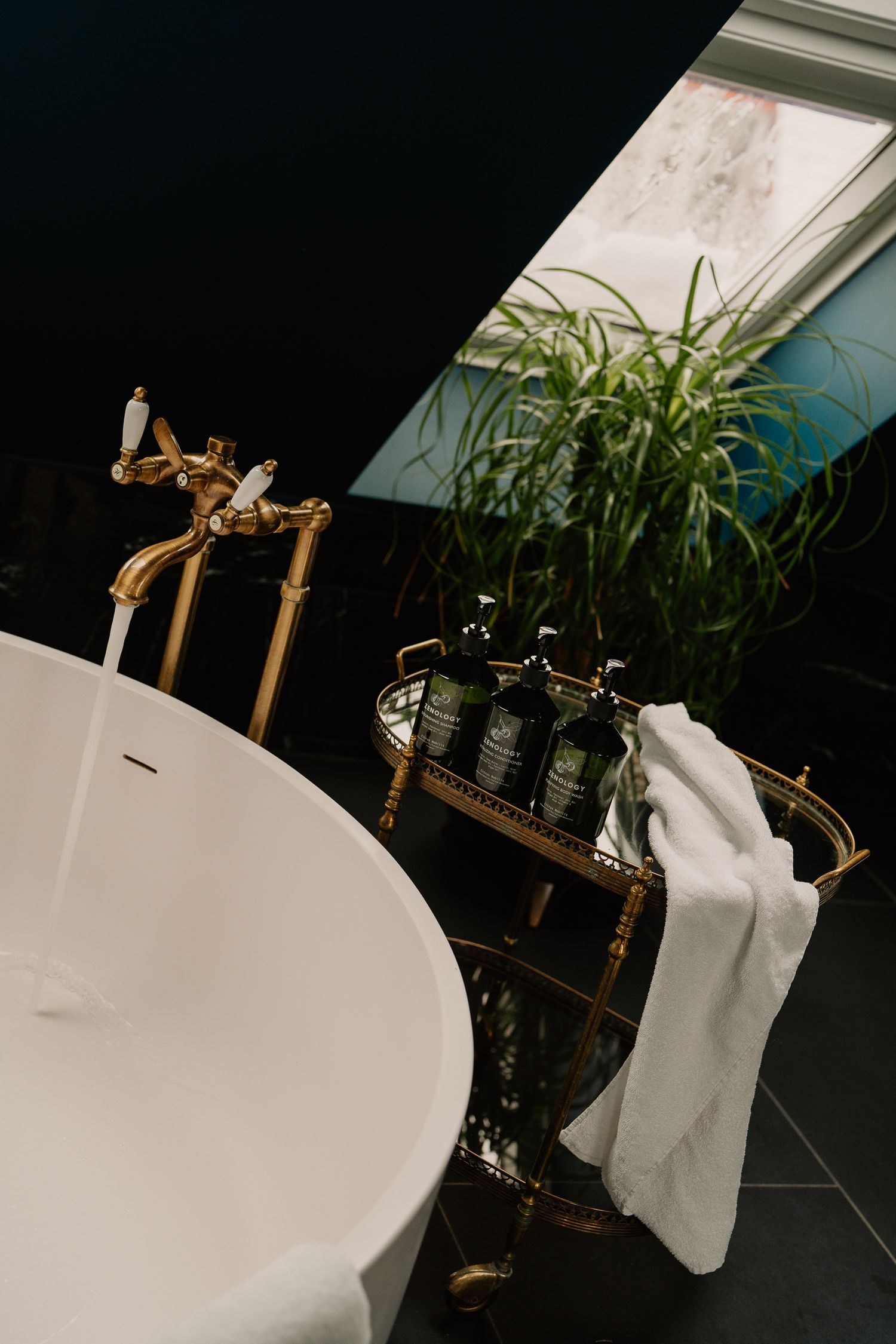 Artistic progression showing multiple angles of a bamboo plant stand with white fabric against a dark background.