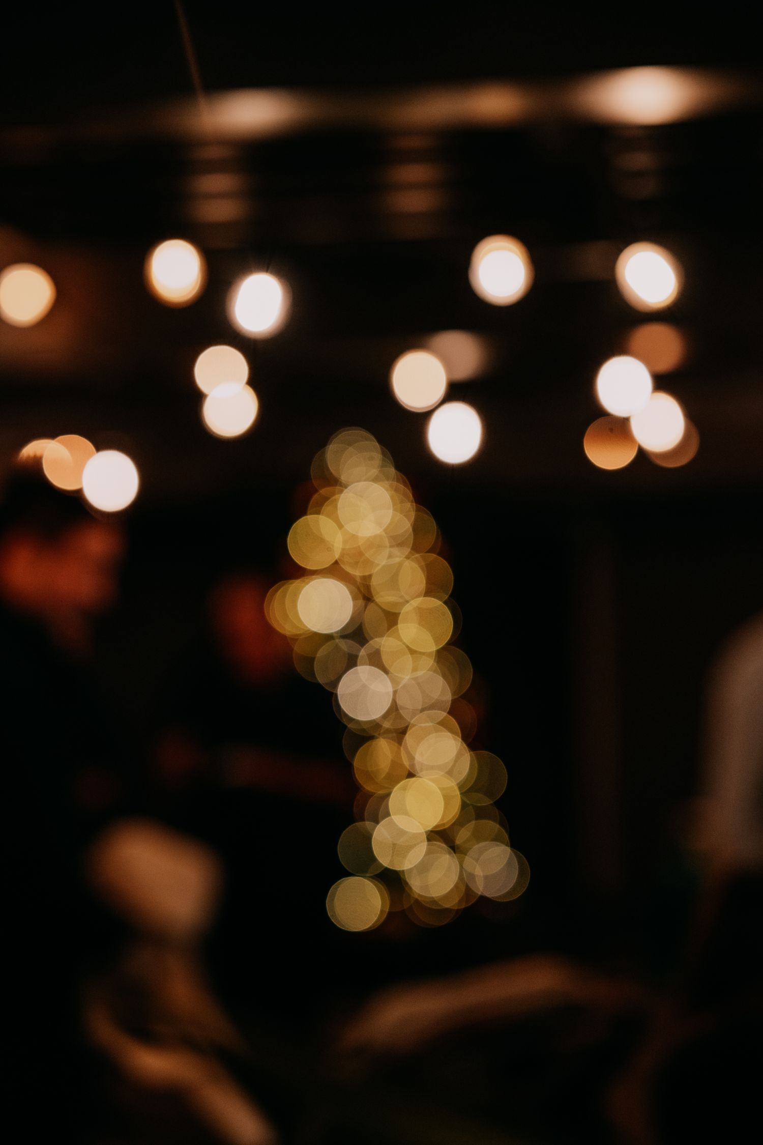 Bokeh lights create a dreamy out-of-focus effect against a dark background in a series of similar photos.