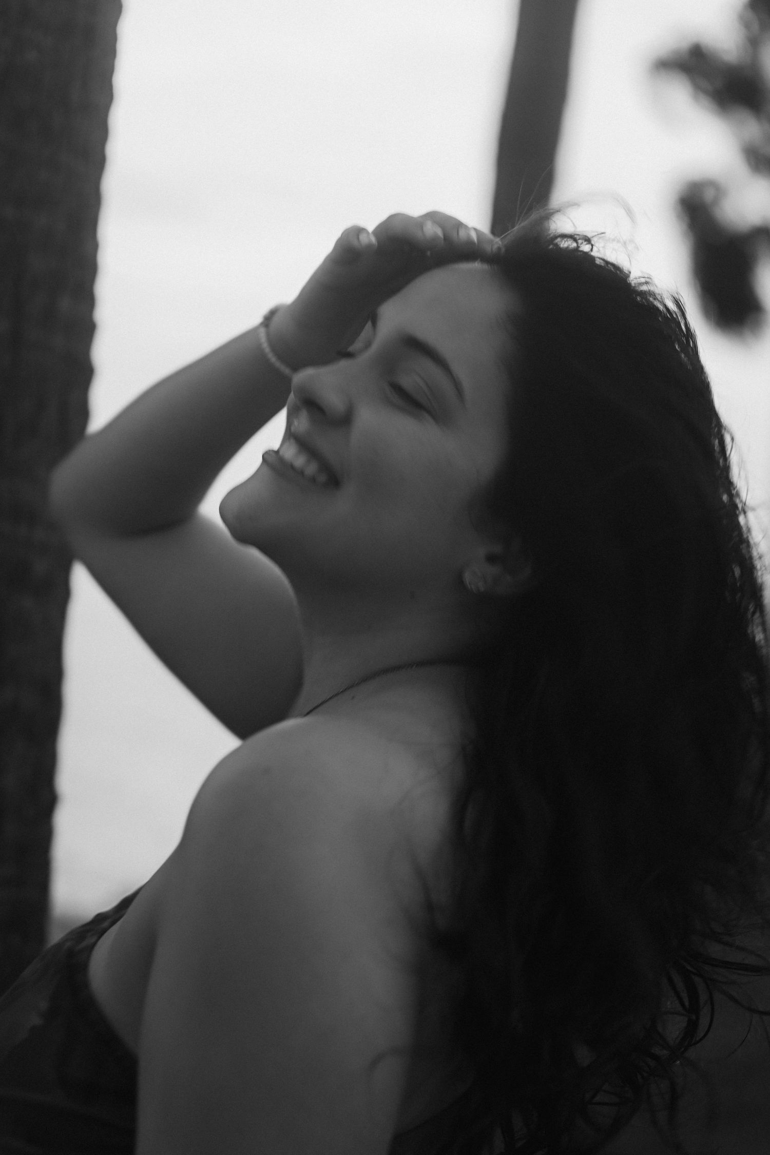 Black and white portrait series capturing carefree moments and natural expressions.