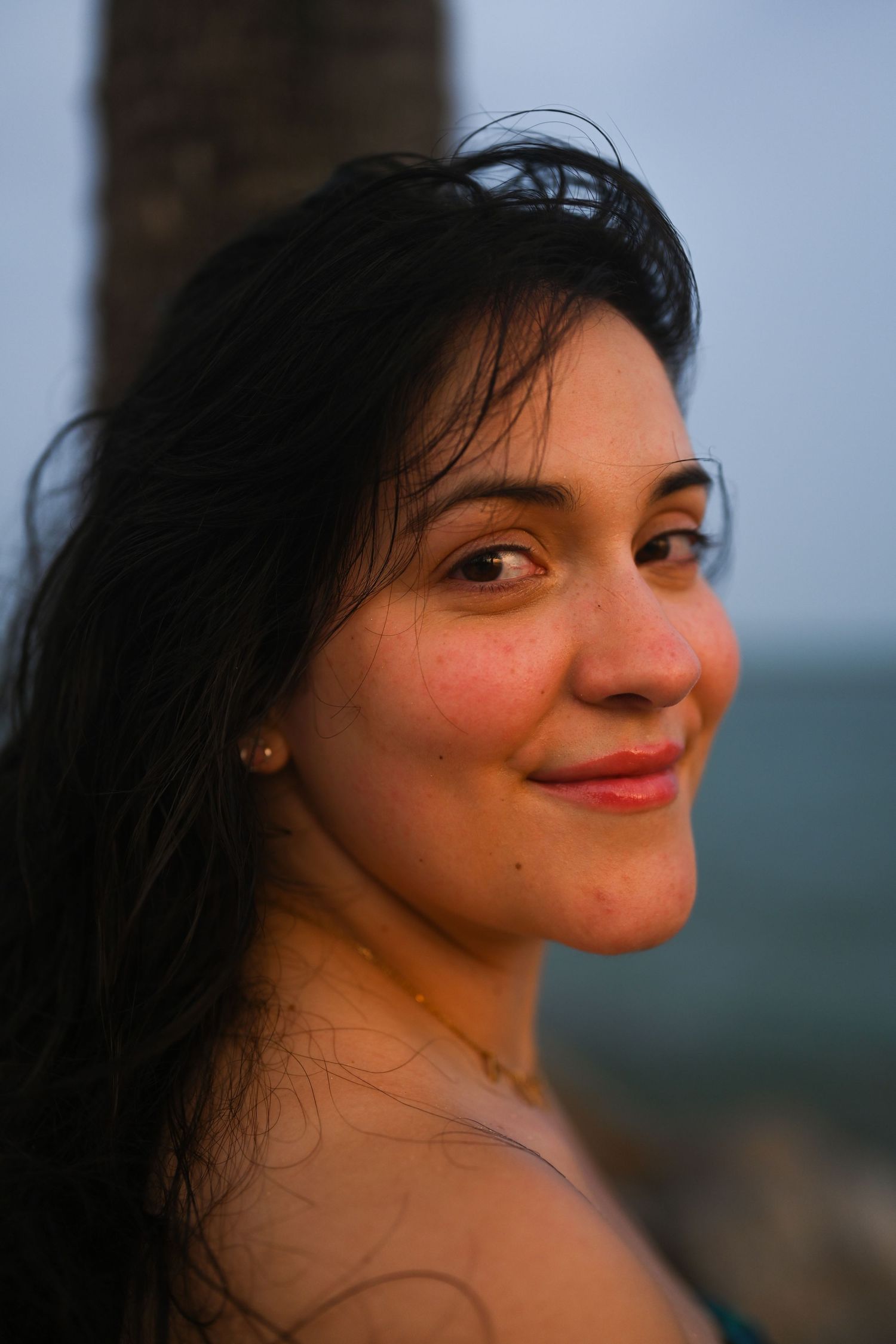 Close-up profile shots showing joyful expressions and natural lighting at sunset.