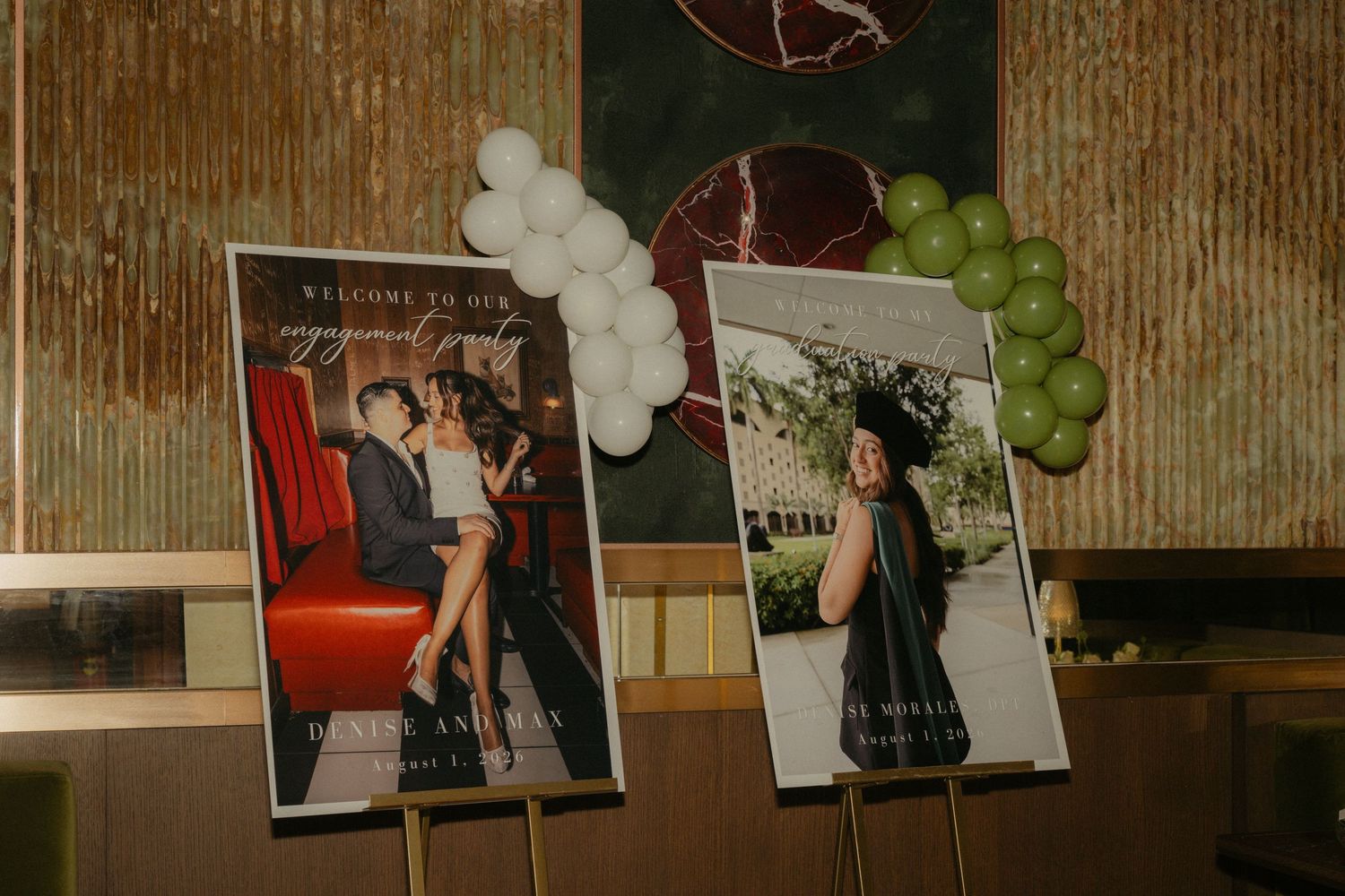 Elegant engagement party display with framed couple photos on easels decorated with white and green balloon garlands.