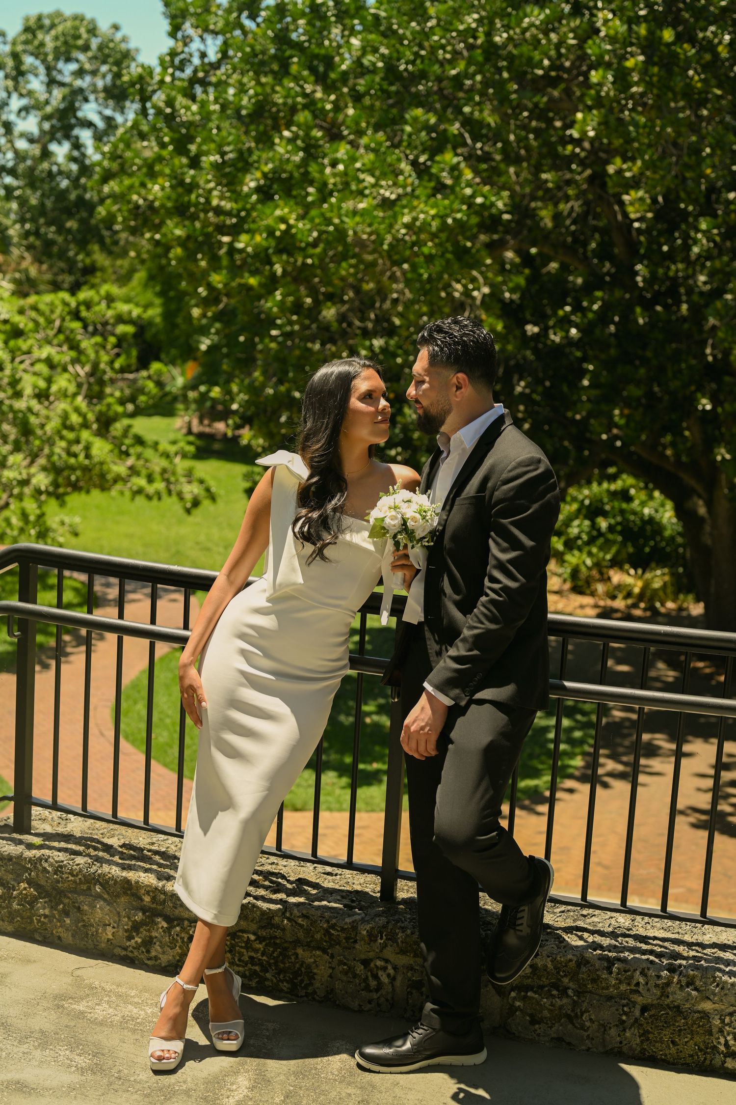 A romantic sequence on a sunny terrace shows a couple's intimate moments.