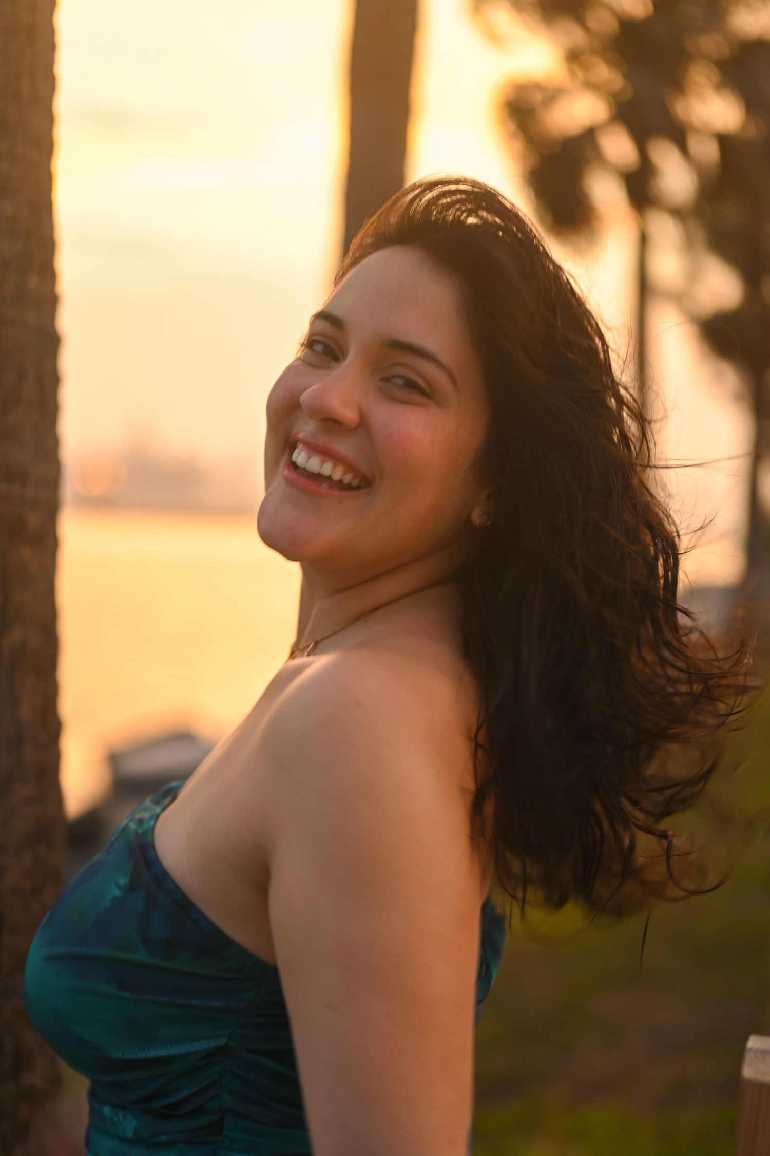 Candid portraits showing genuine laughter and happiness during golden hour.