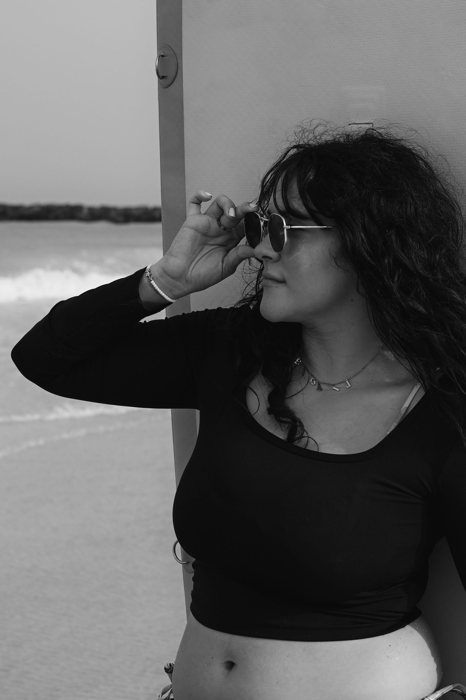 Artistic black and white portrait sequence showing dynamic poses in dark clothing.