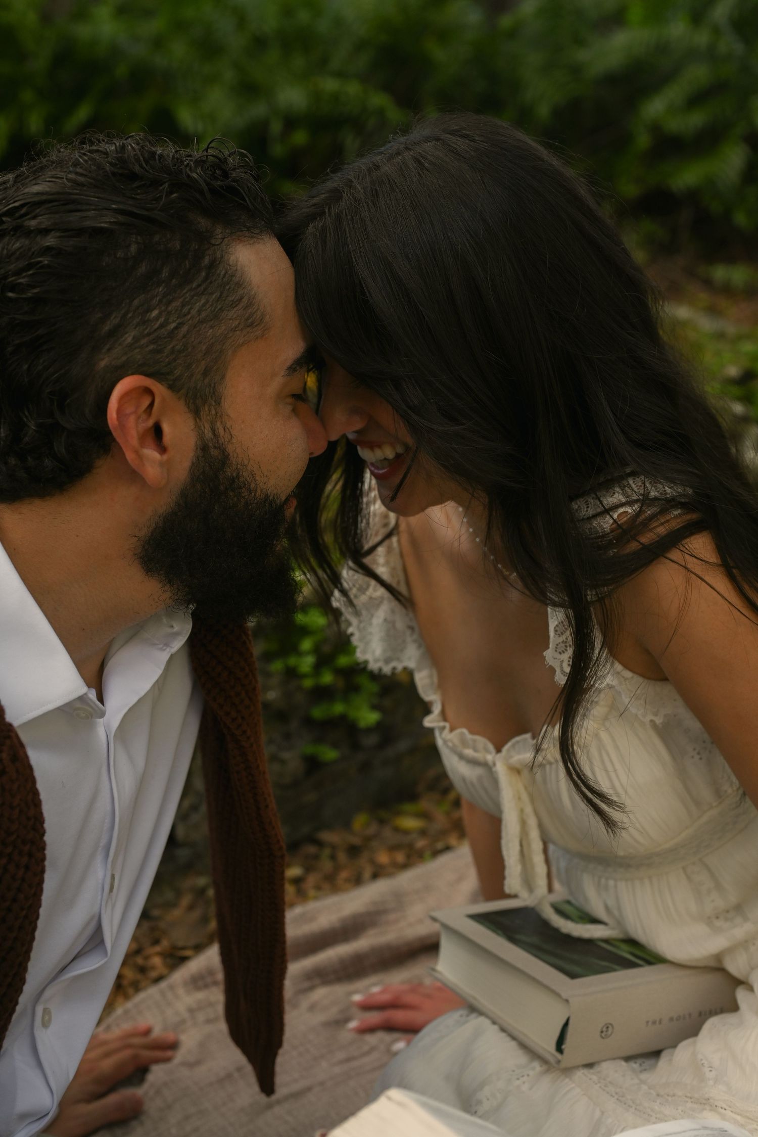 A romantic sequence of wedding photos showing a couple in white and formal attire sharing intimate moments together.