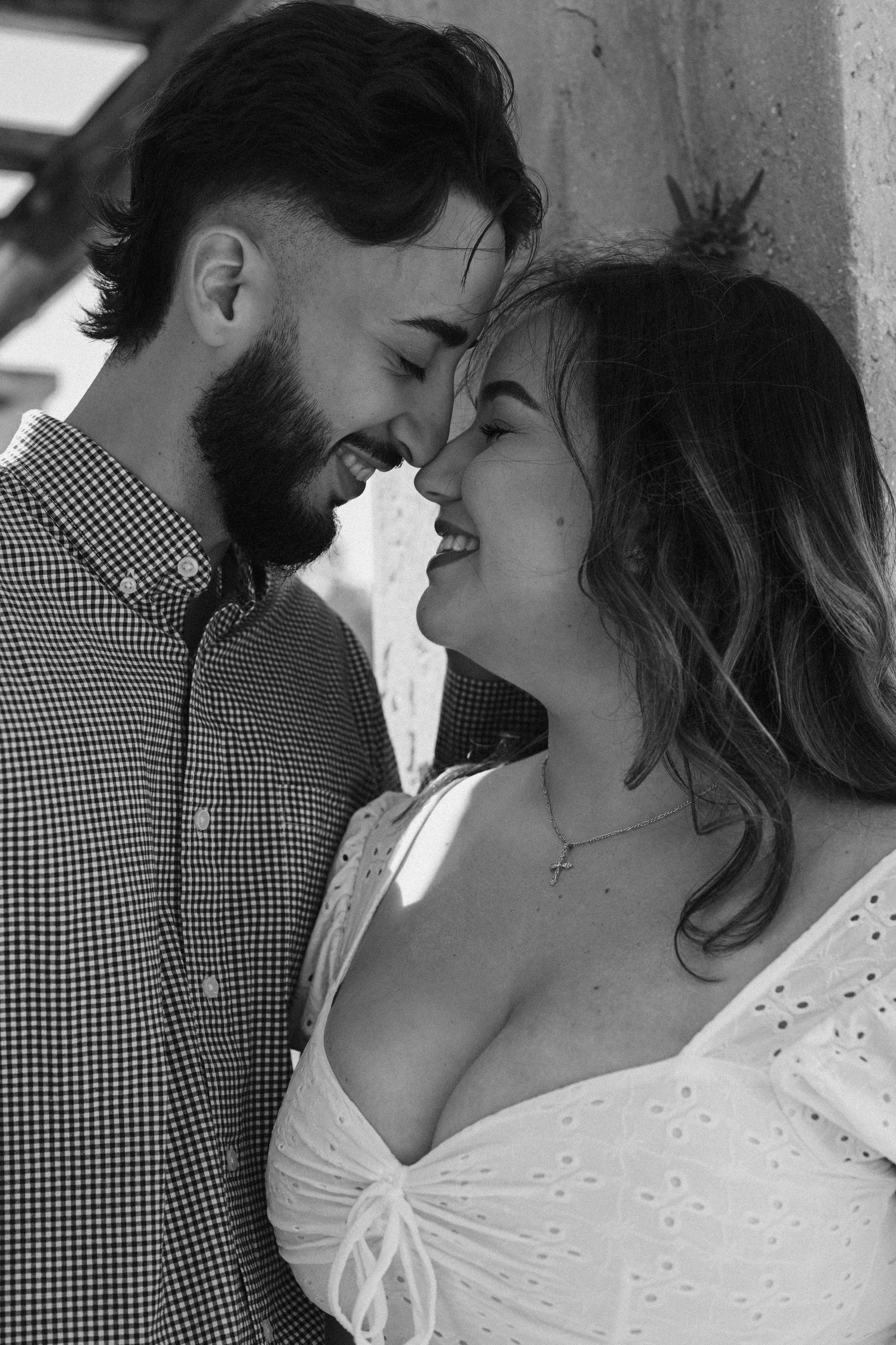 Black and white photos showing tender moments between a couple.