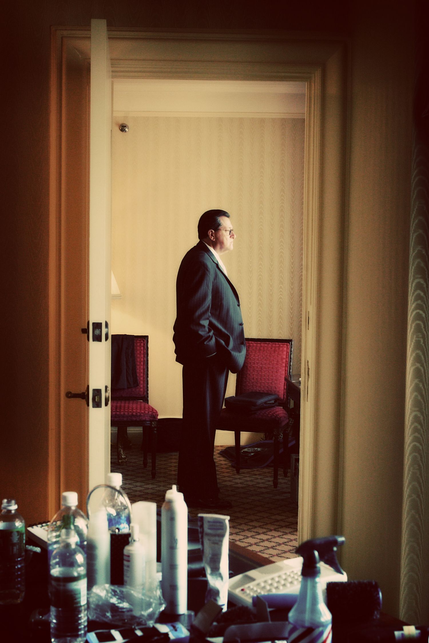 A sequence of six photos showing a person walking through a hotel hallway with a warm sepia-toned lighting effect.