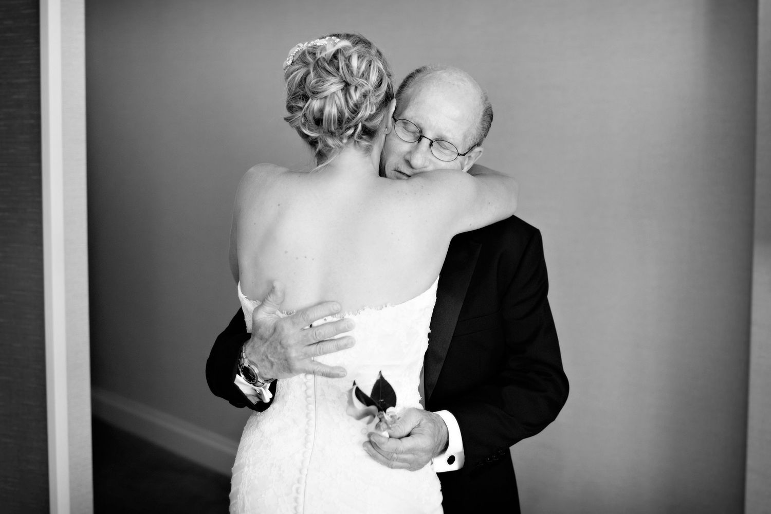 Black and white wedding photos show intimate dance moments between bride and groom at their reception.