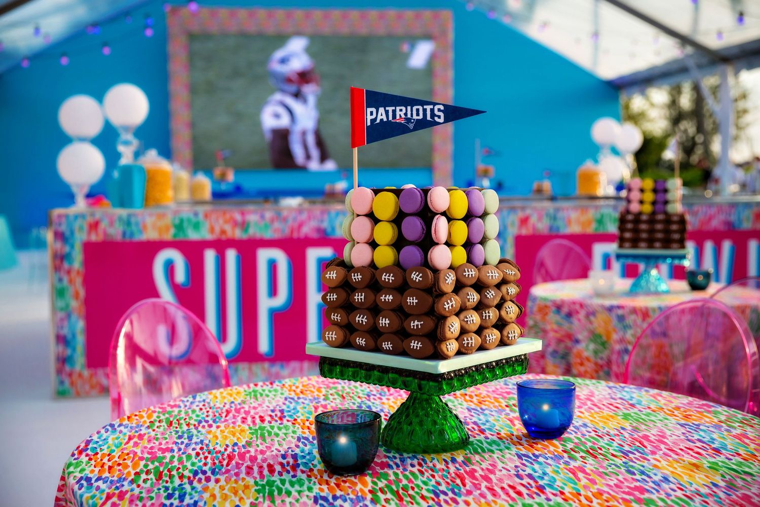 Patriots-themed dessert display with chocolate tower and colorful candy decorations.