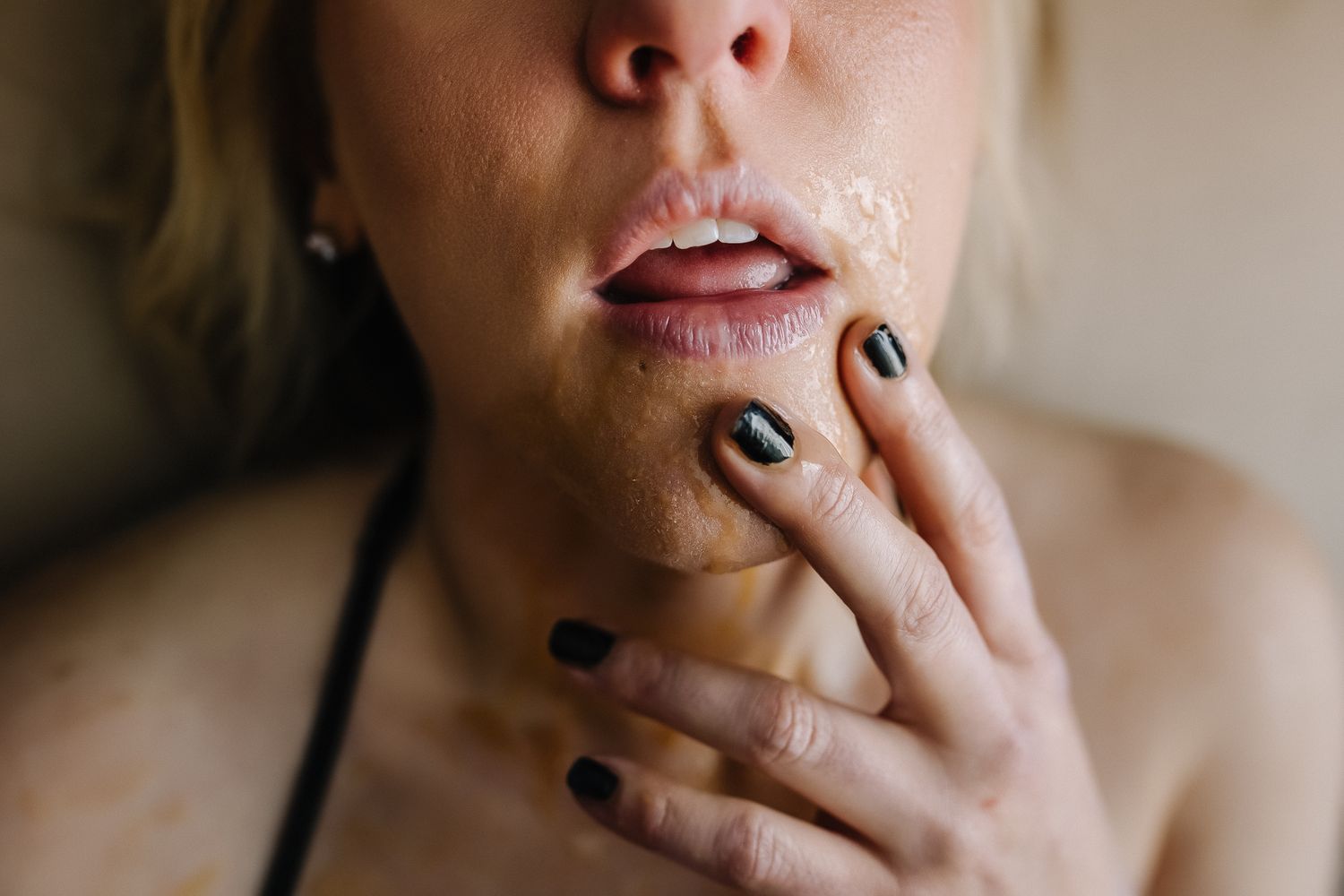Artistic close-up showing smoke, dark nail polish, and dramatic lighting.