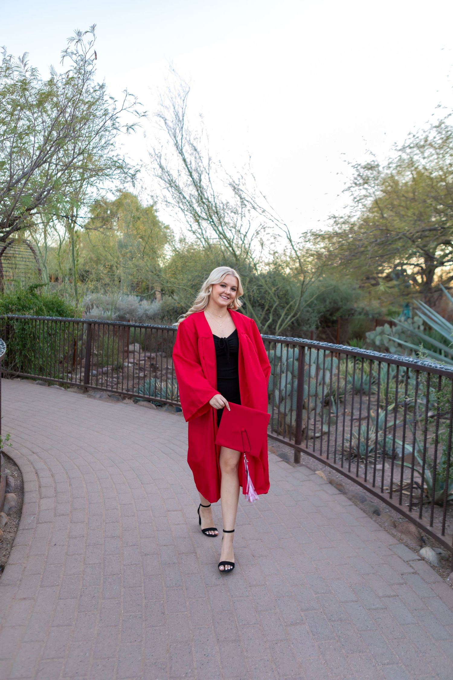 High school senior girl smiling during outdoor photo session in Desert Botanical Gardens