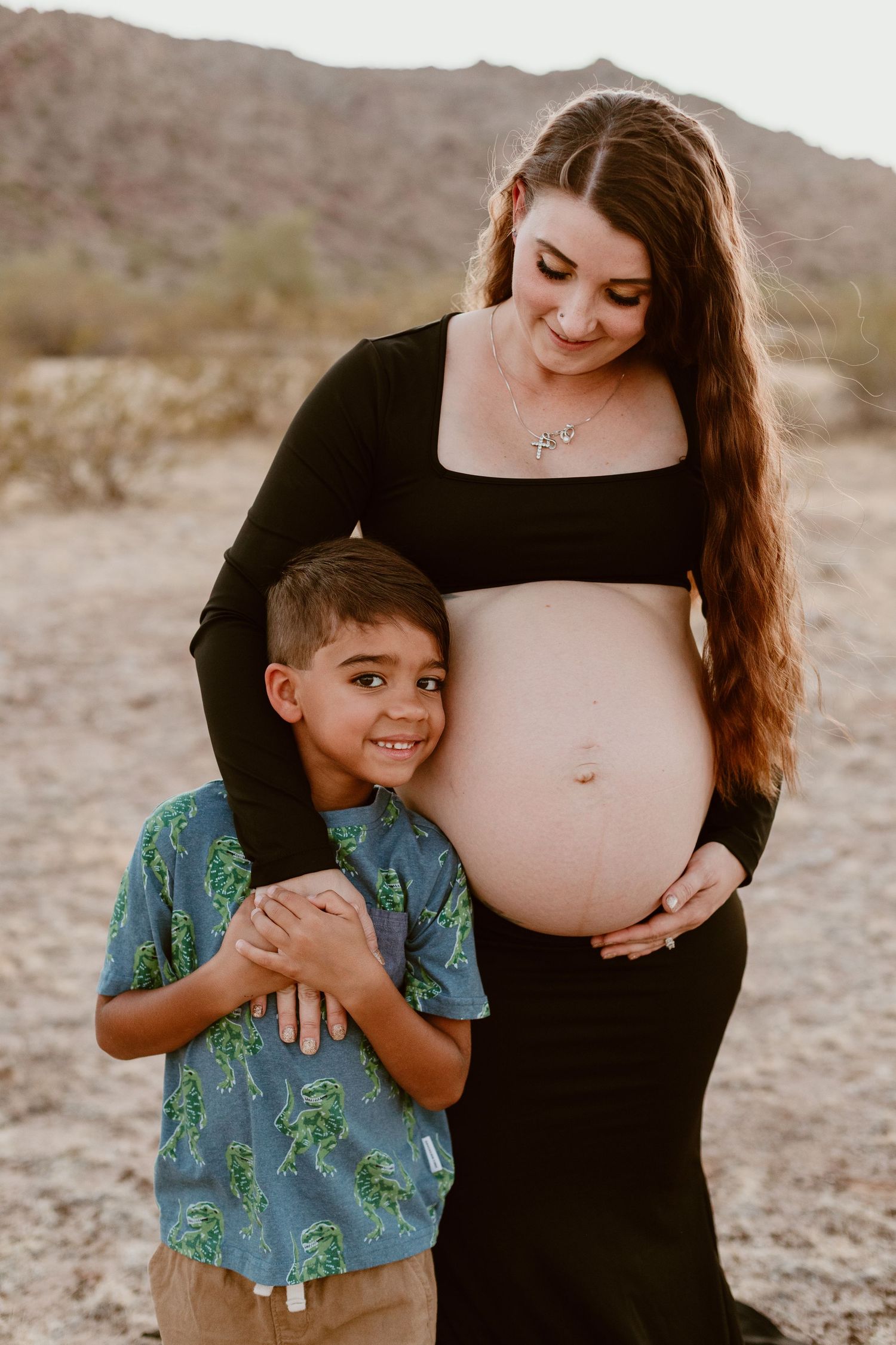 Outdoor maternity photo shoot near Phoenix with cactus and Mountain Views - Arizona Desert Mountain Sunset
