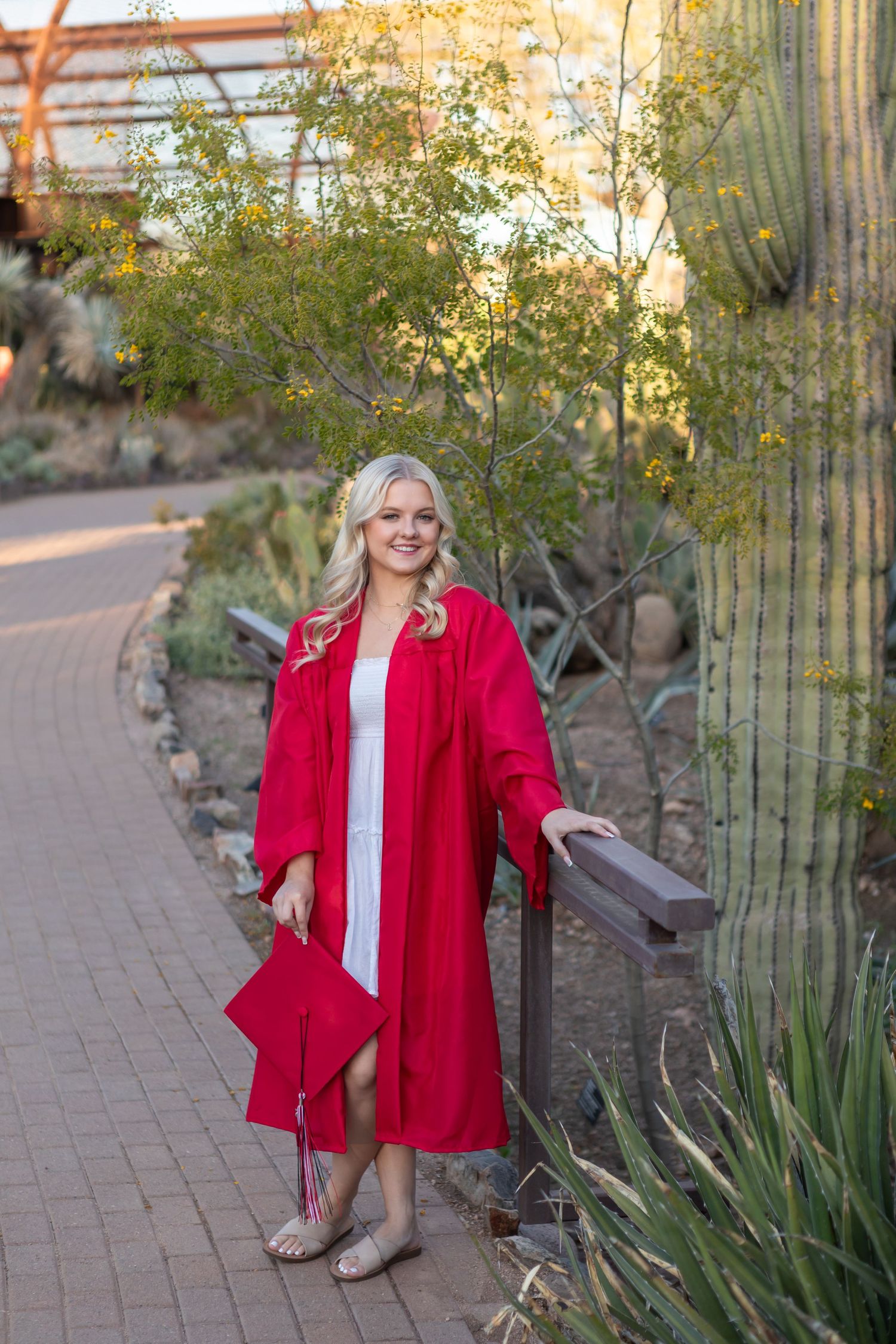 High school senior girl smiling during outdoor photo session in Desert Botanical Gardens