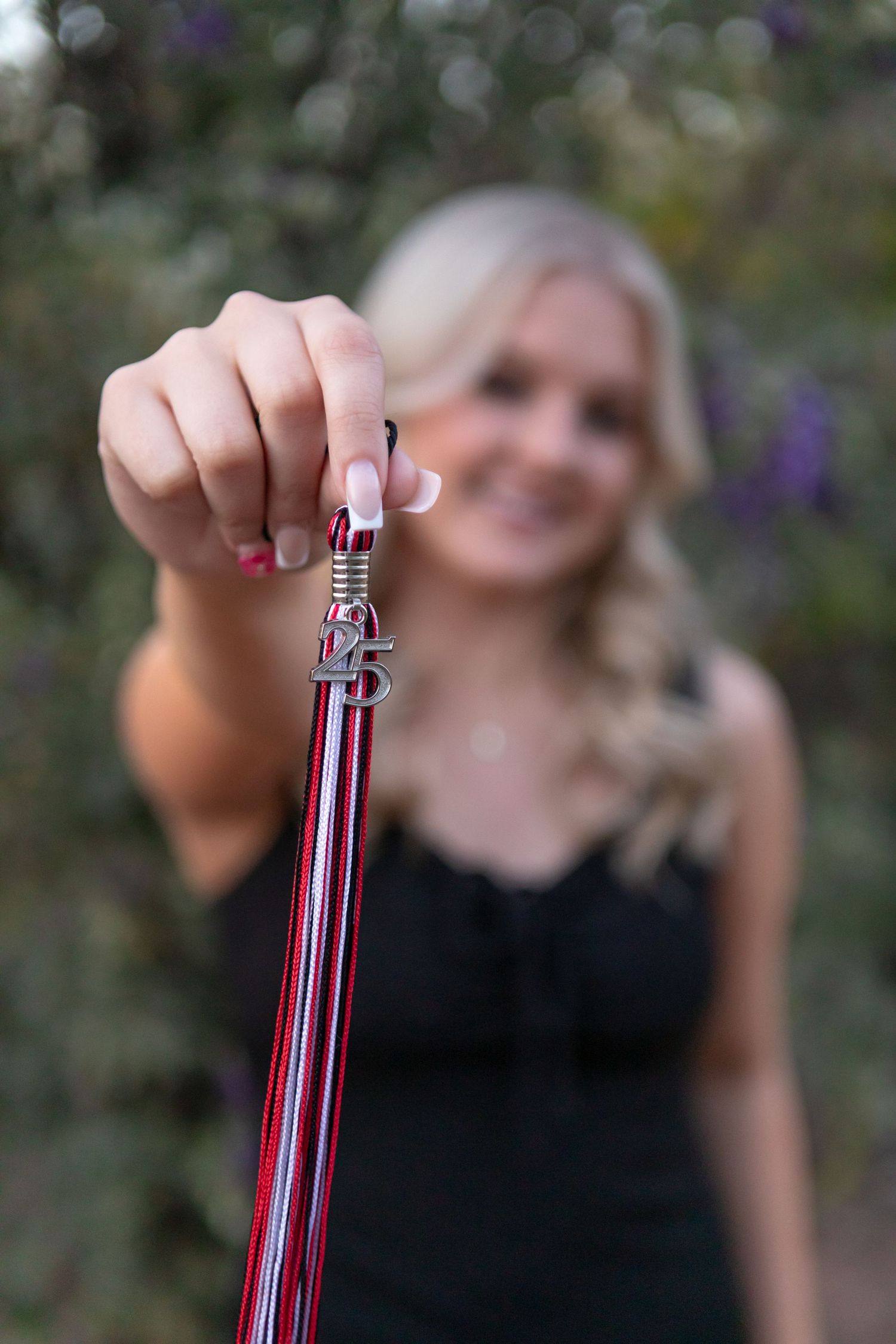 High school senior girl smiling during outdoor photo session in Desert Botanical Gardens