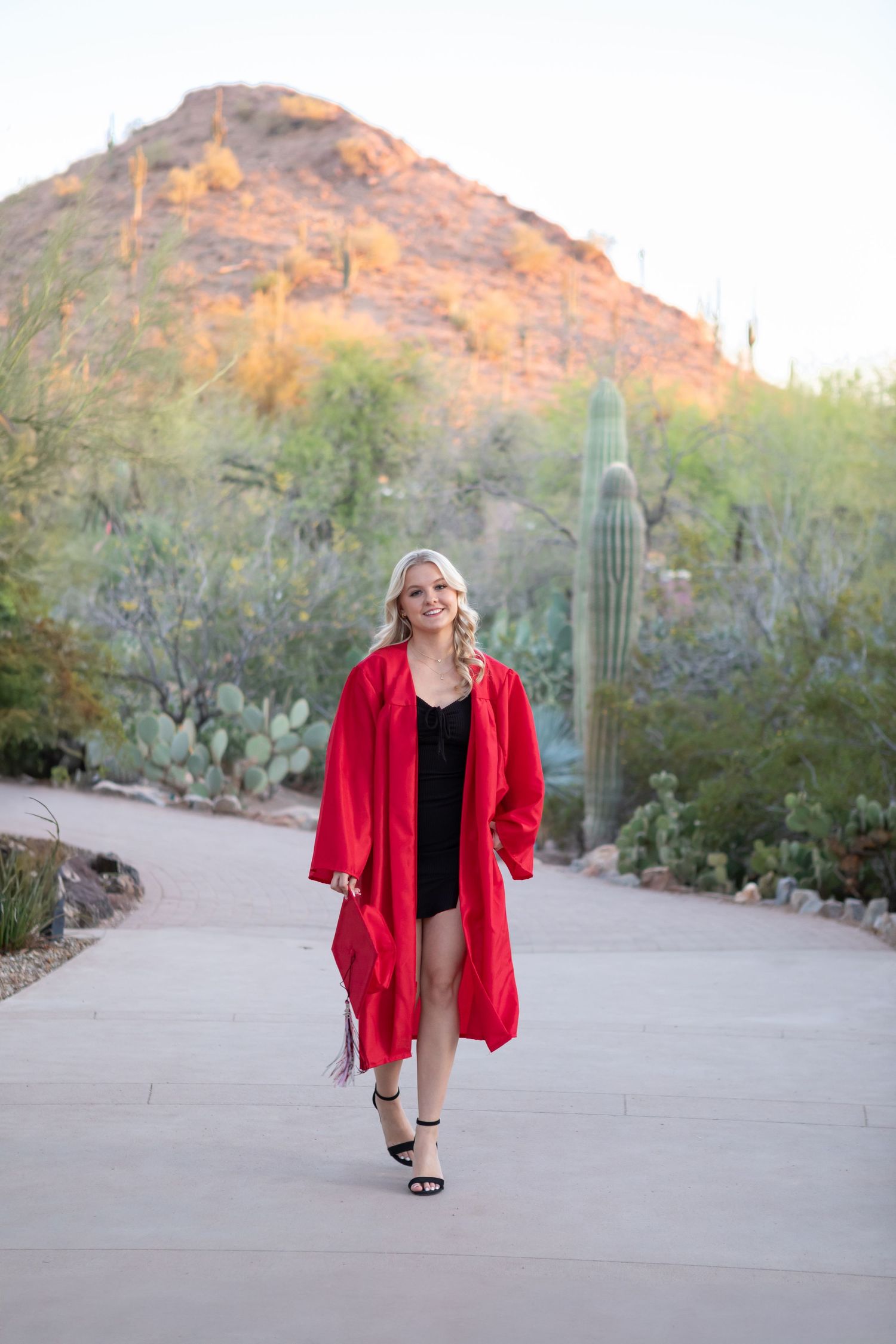 High school senior girl smiling during outdoor photo session in Desert Botanical Gardens