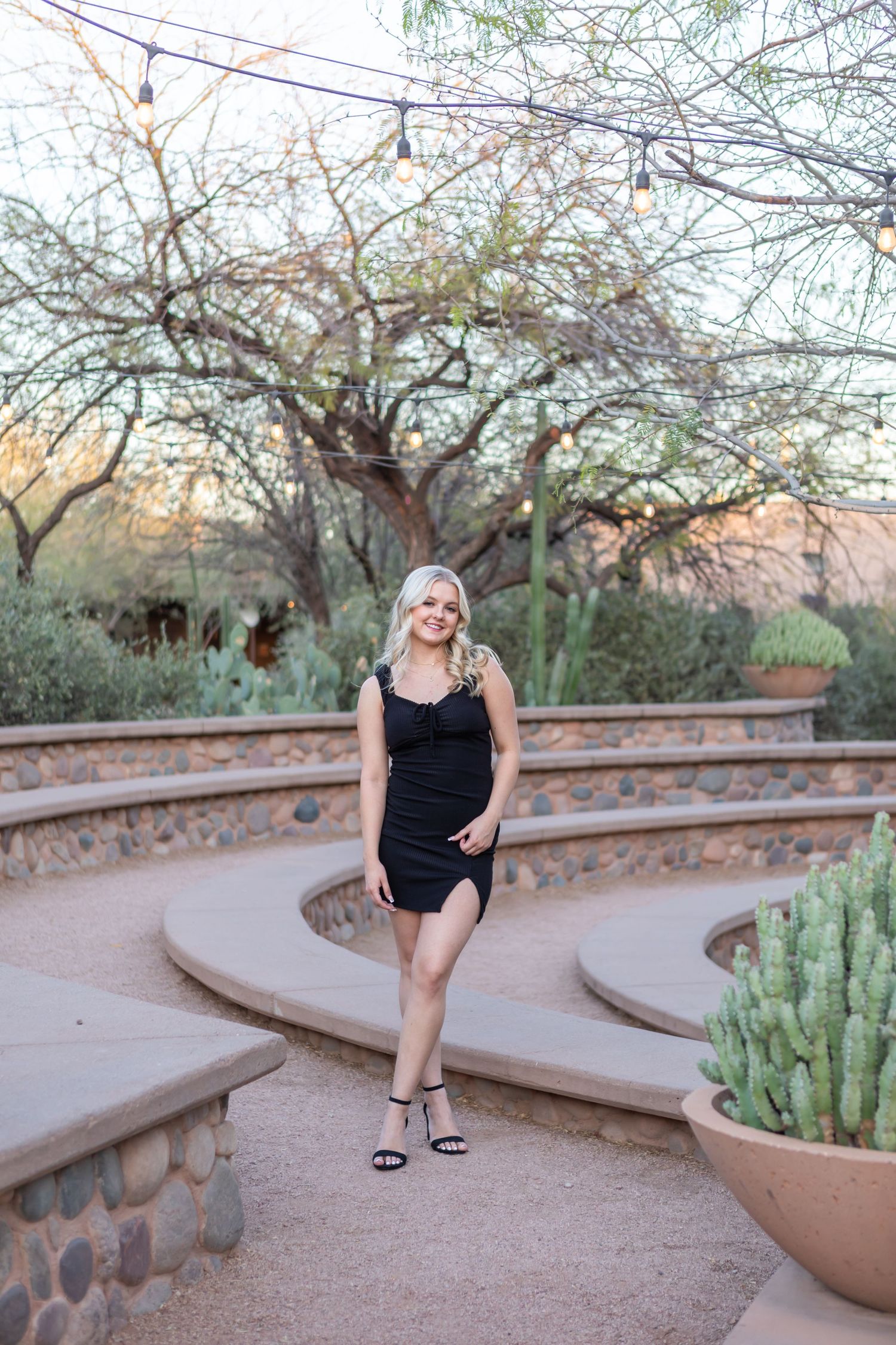 High school senior girl smiling during outdoor photo session in Desert Botanical Gardens