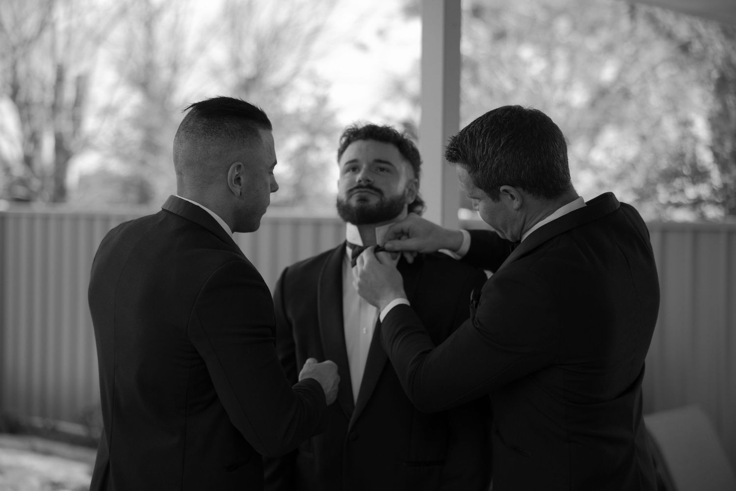 Black and white photo series shows a person smoking a cigarette in progressive stages of consumption.