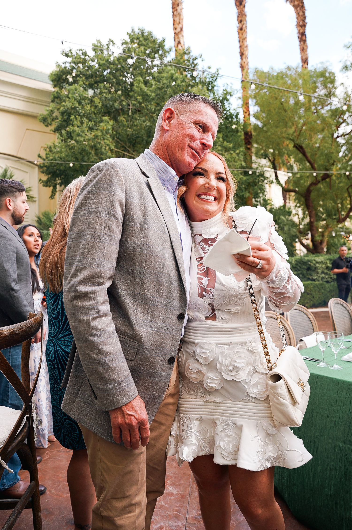 Couple sharing joyful moment together at outdoor celebration.