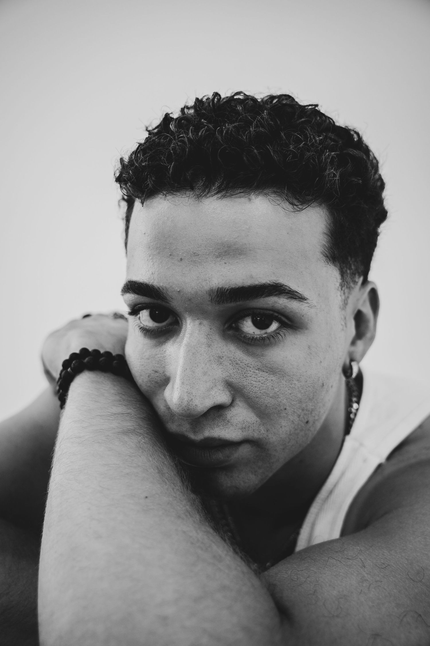 Experimental portrait sequence using hands and shadows to create visual narrative in black and white.