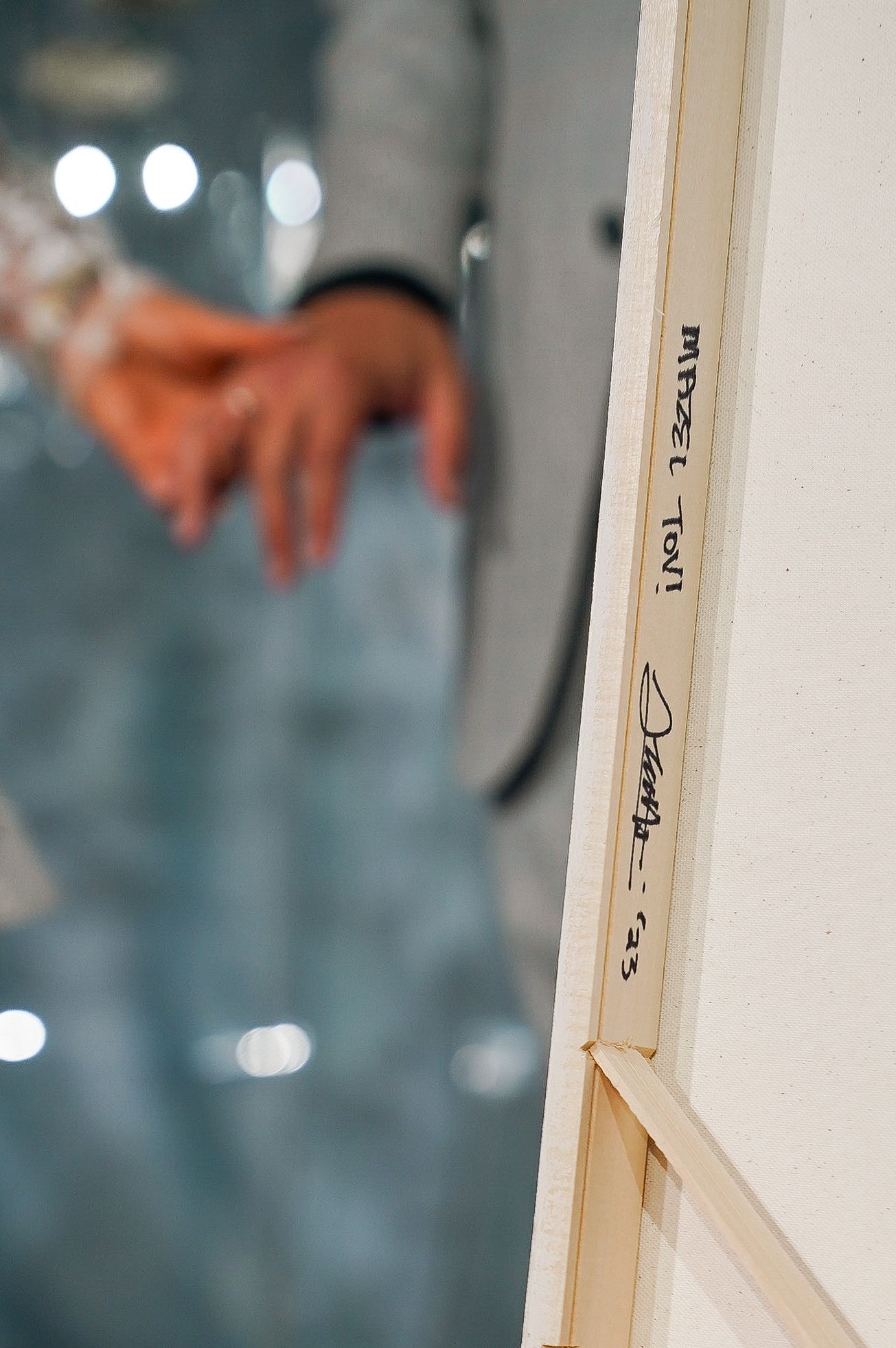 Close-up of a white door frame with text markings in soft focus.