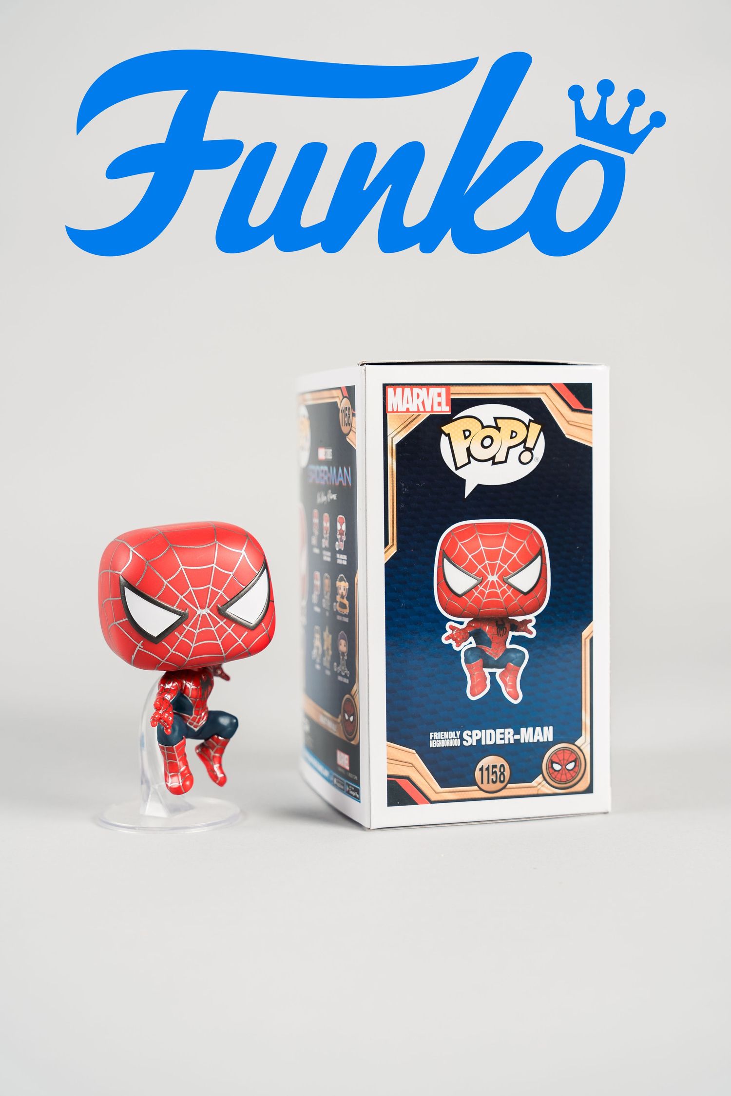 Spider-Man Funko Pop vinyl figure shown from multiple angles with retail box.
