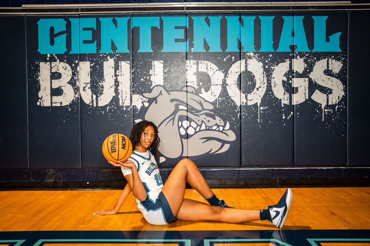 Action shot of basketball drills against Centennial Bulldogs wall mural.