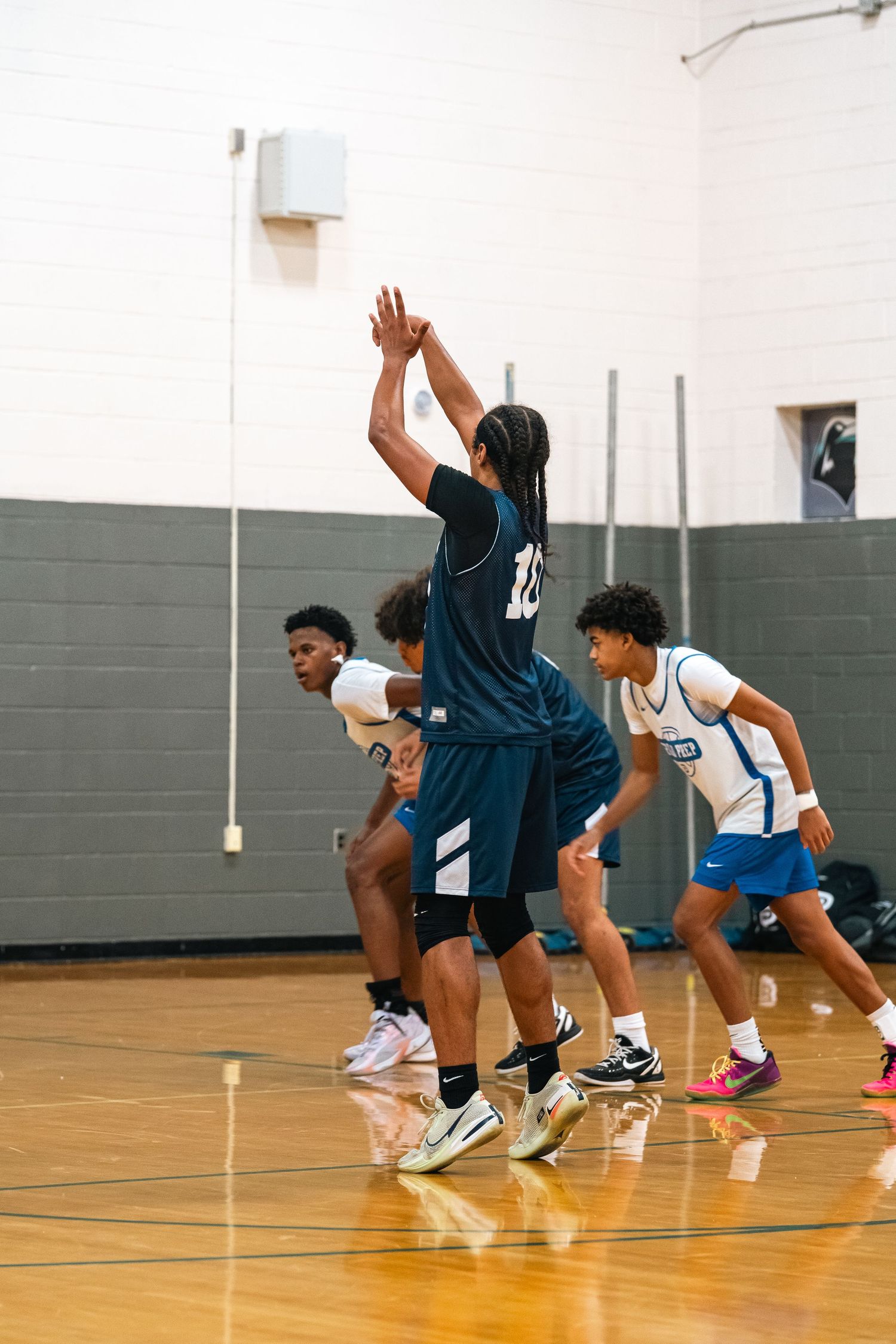 Basketball players compete for possession during fast-paced game action.