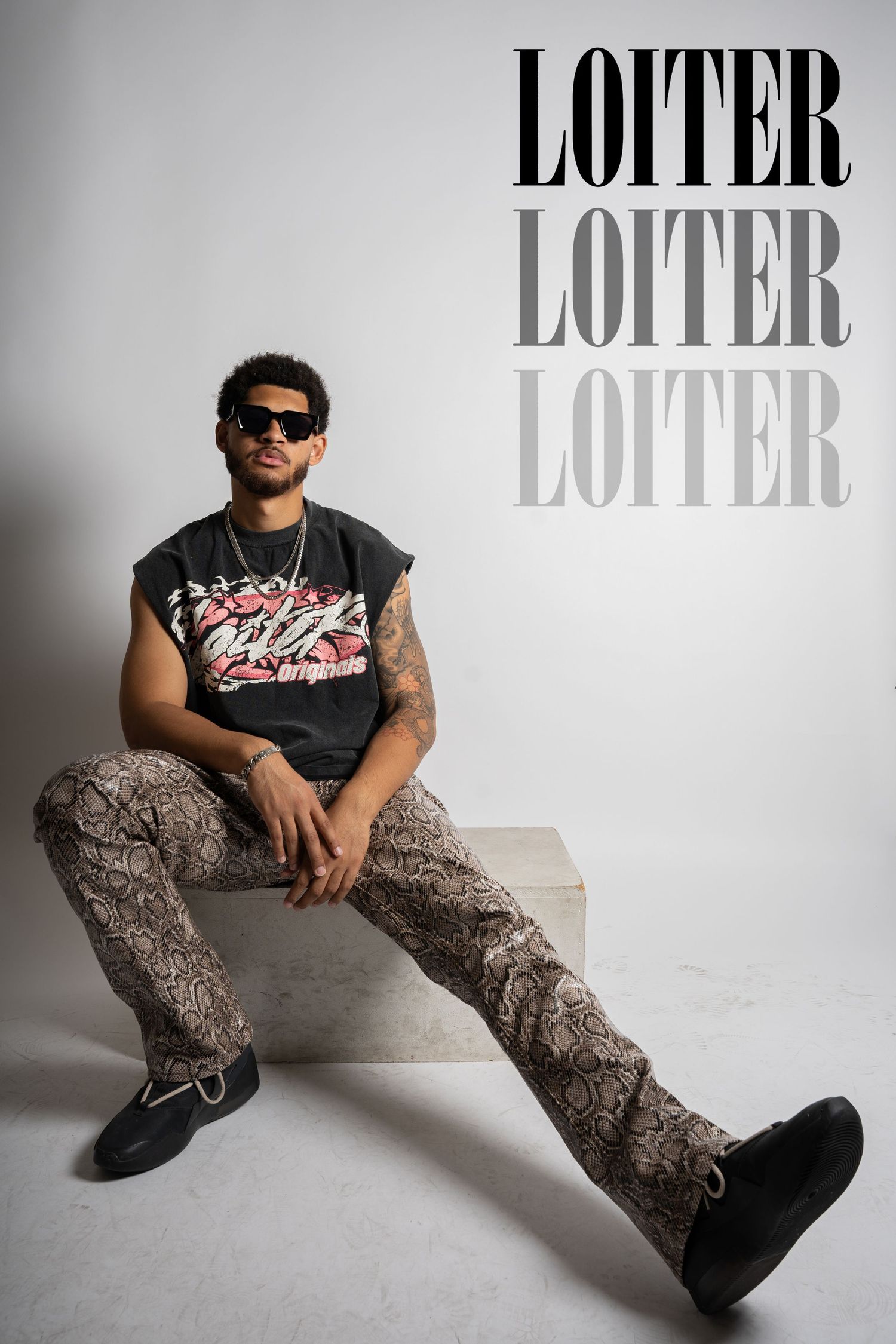 Fashion editorial featuring streetwear style with LOITER text overlay.