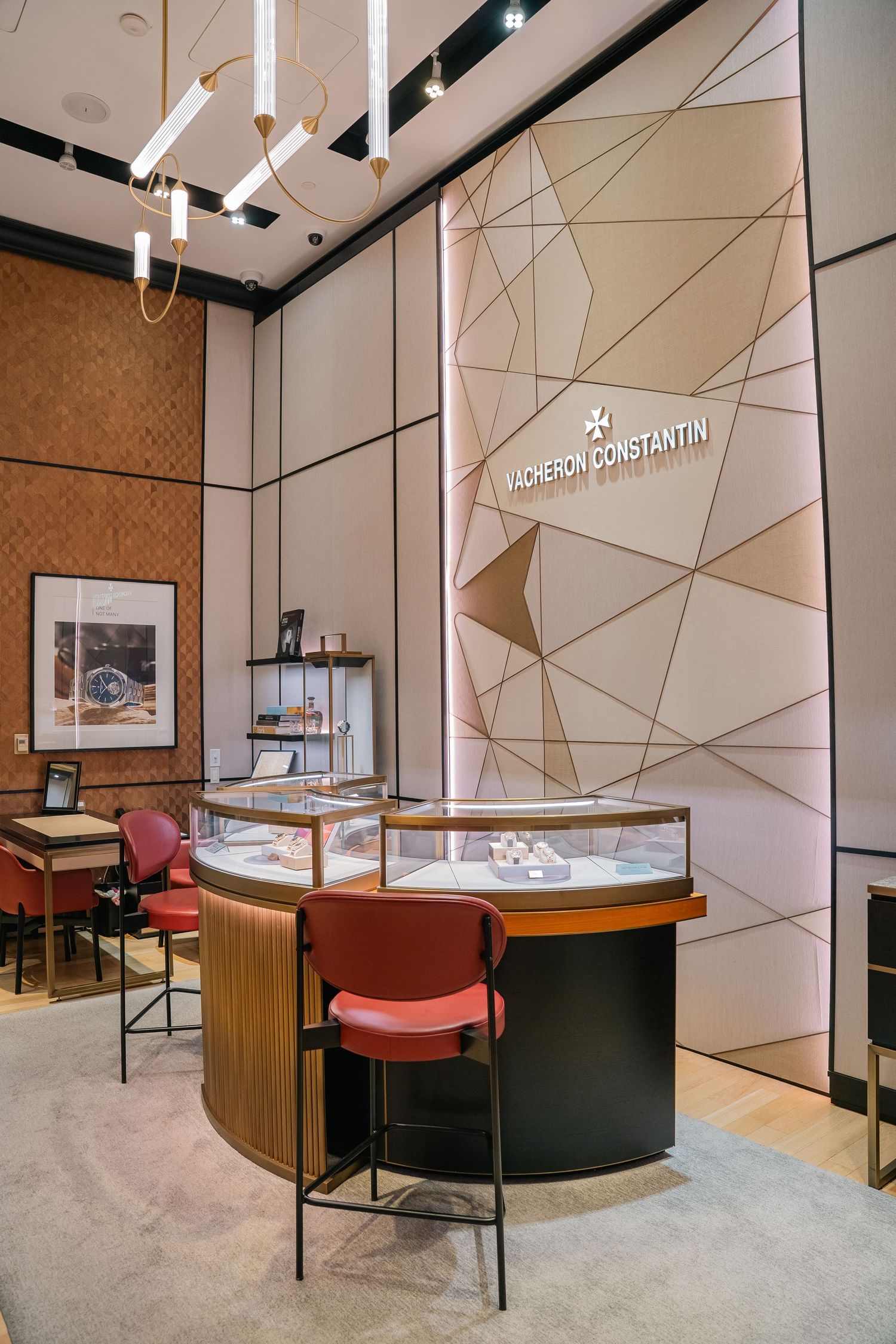 Vacheron Constantin boutique interior featuring geometric wall patterns and display cases.