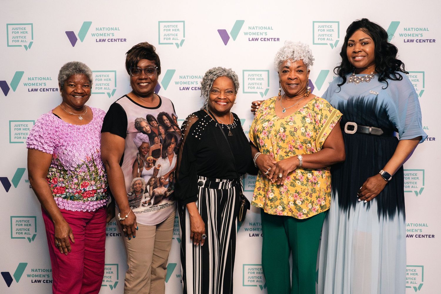 Group photo of attendees at event with Victory Fund step-and-repeat backdrop.
