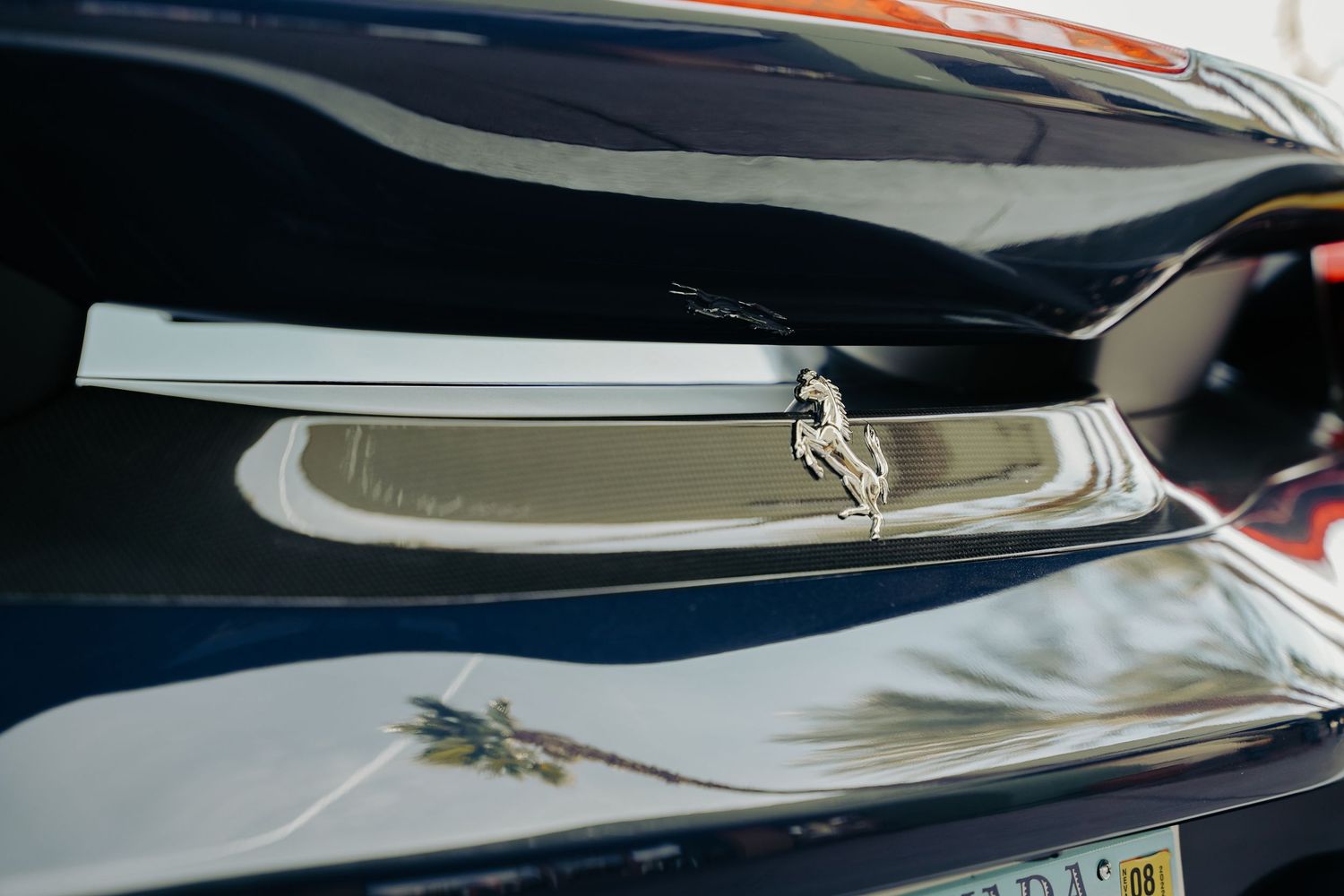 Chrome trim detail on a black luxury vehicle exterior.