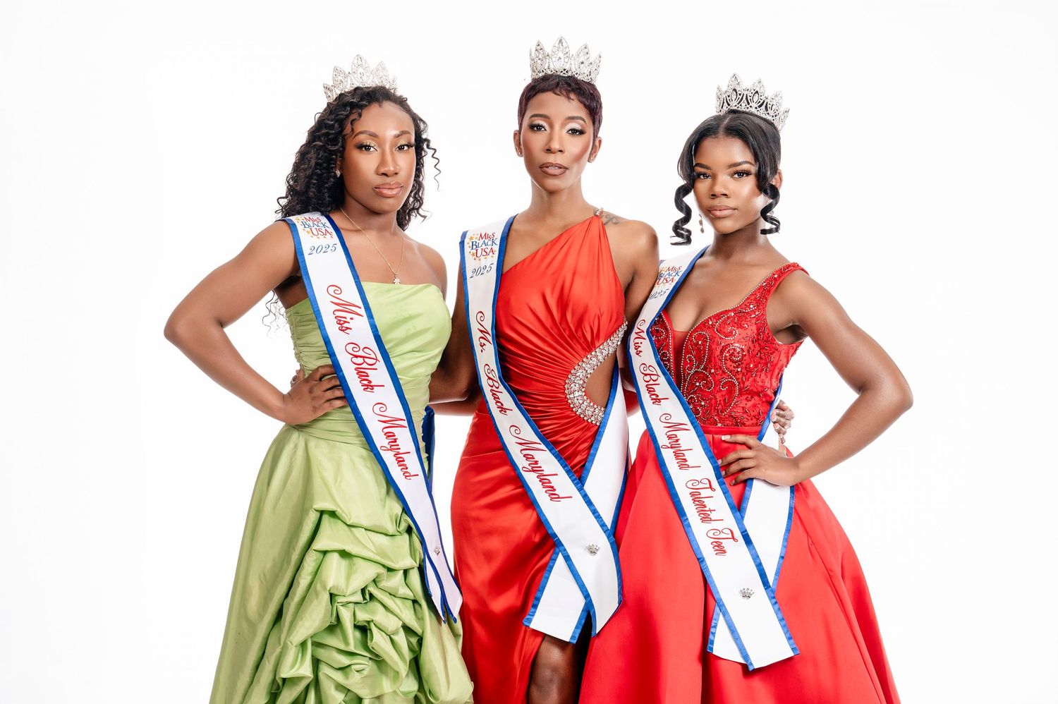 A group of beauty pageant contestants wearing evening gowns and sashes pose together for a formal photo.