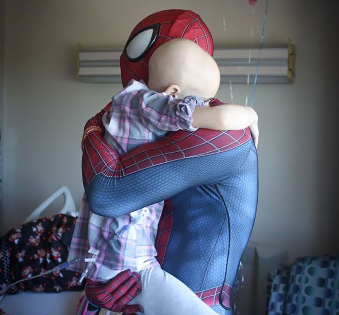 spiderman hugging cancer patient child
