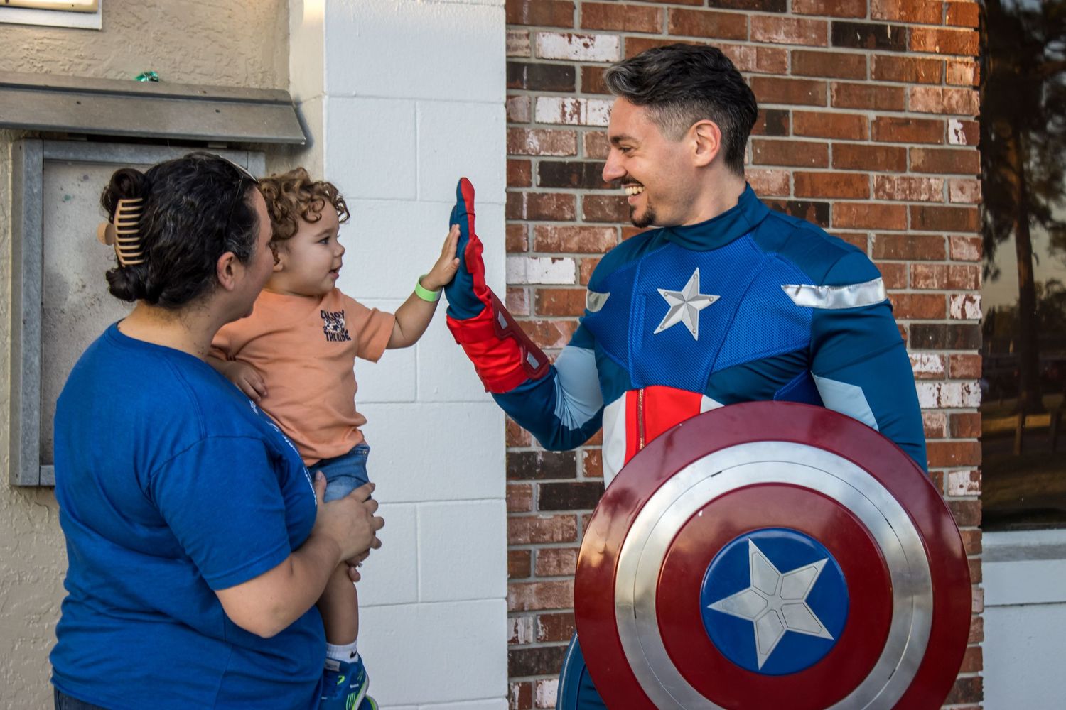 daniel harris captain america high fives boy
