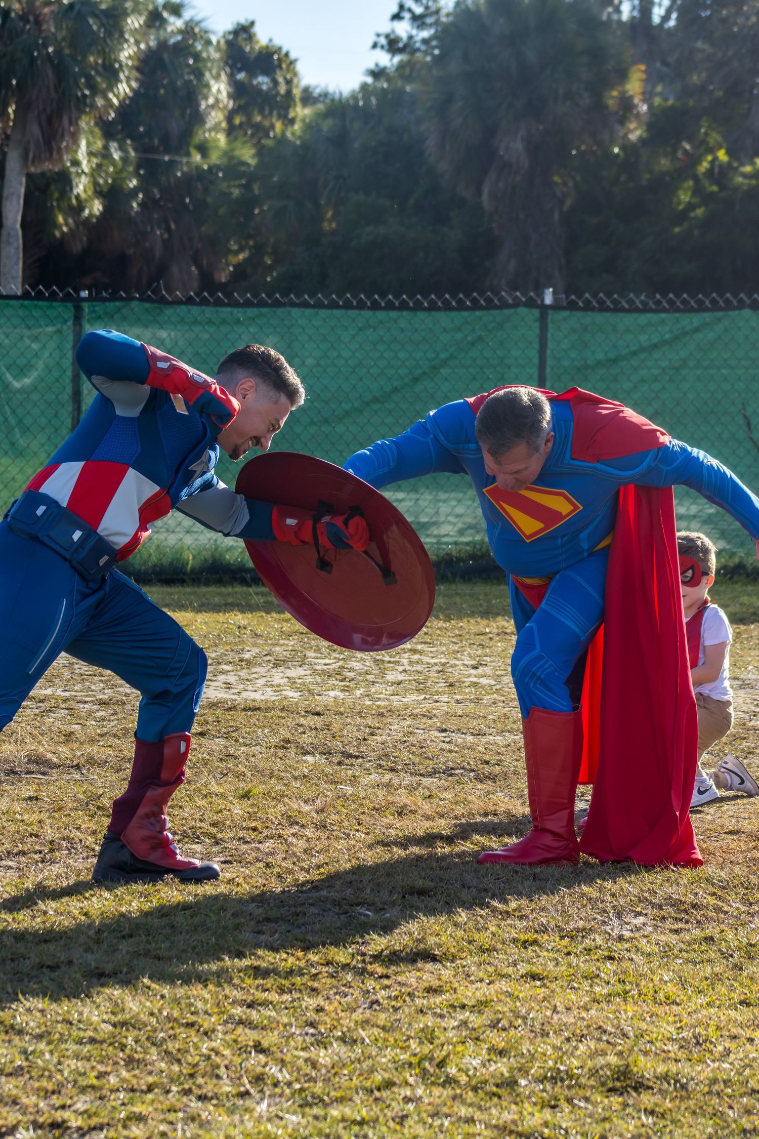 Captain America and super man posing