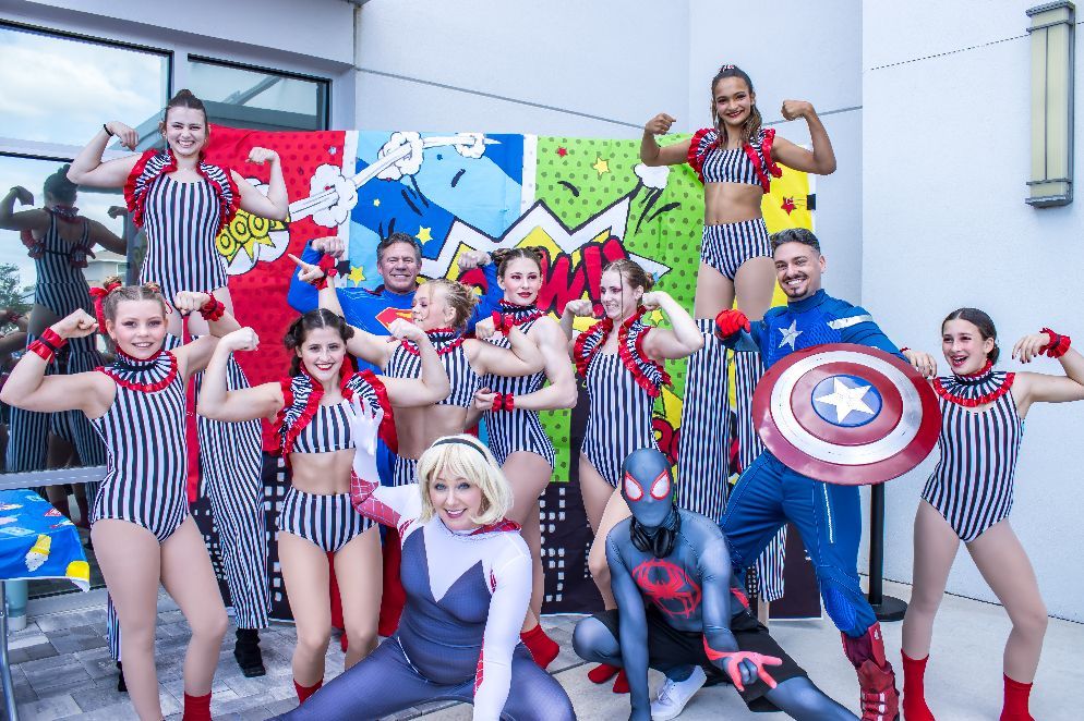 grace church family fun day with heroes posing together with dancers