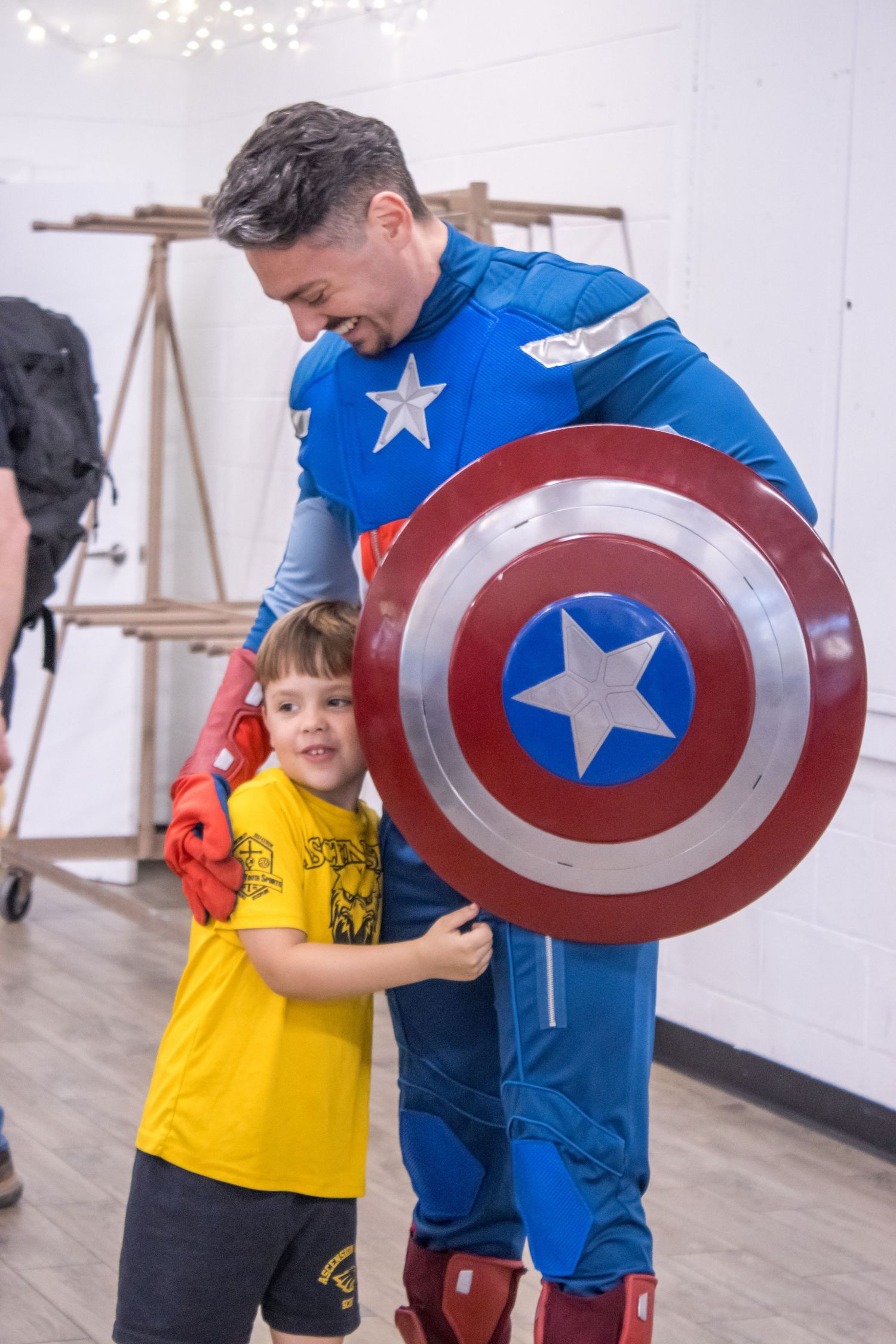 daniel harris captain america hugs boy