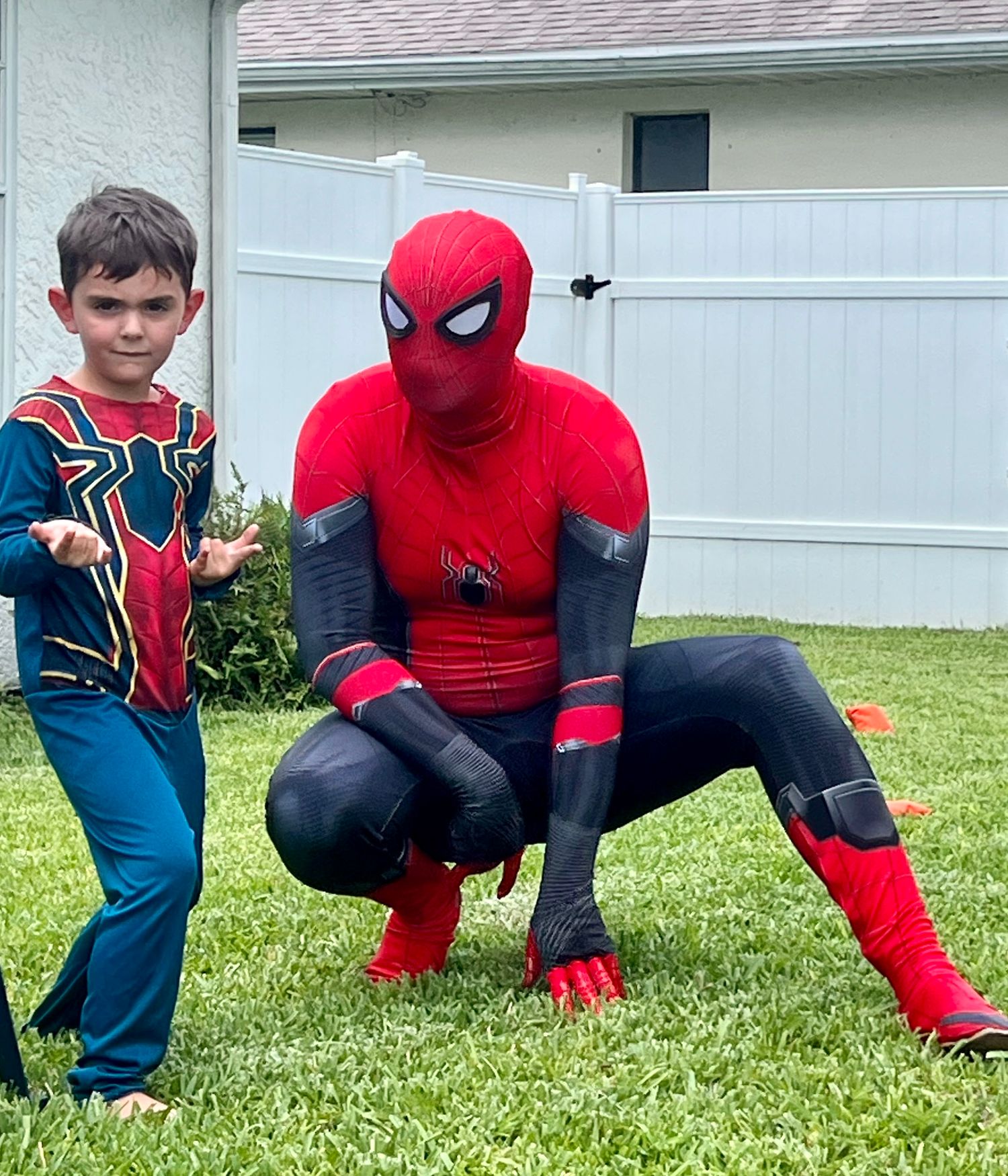 spiderman and young boy posing