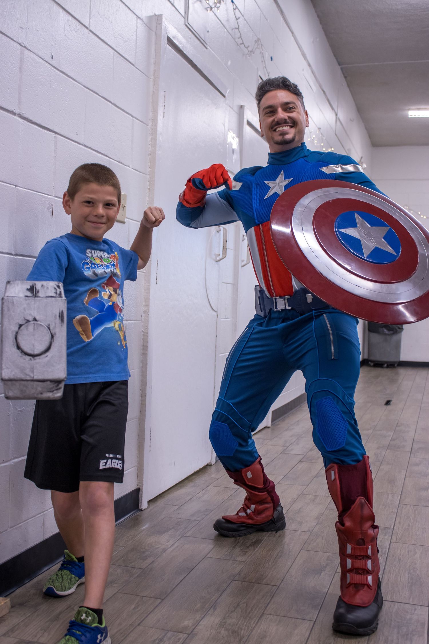 daniel harris captain america poses with boy