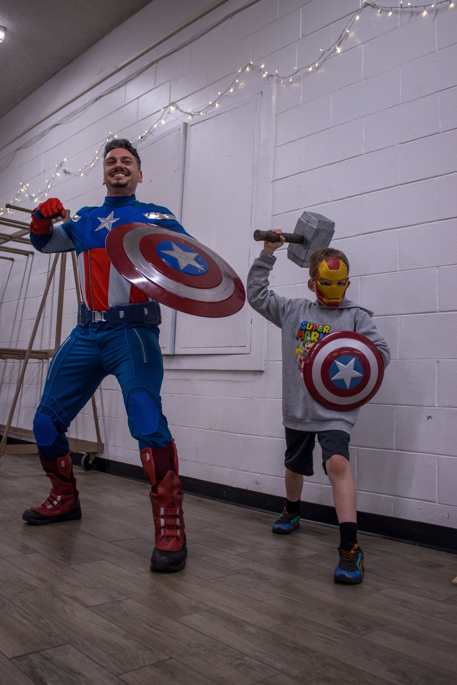 daniel harris captain america poses with boy